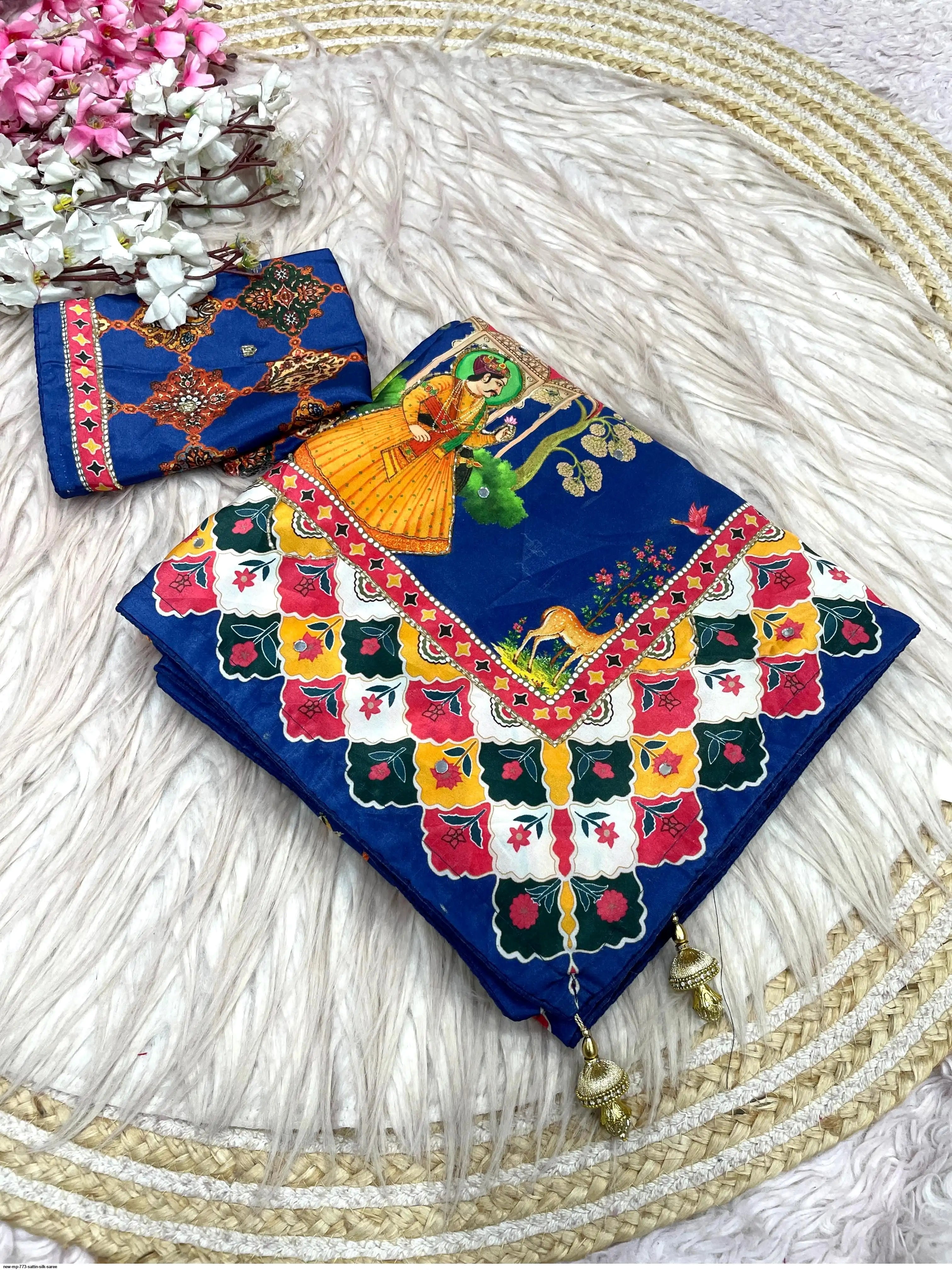 These Bollywood-style satin silk sarees feature vibrant Pichwai digital prints and  handwork