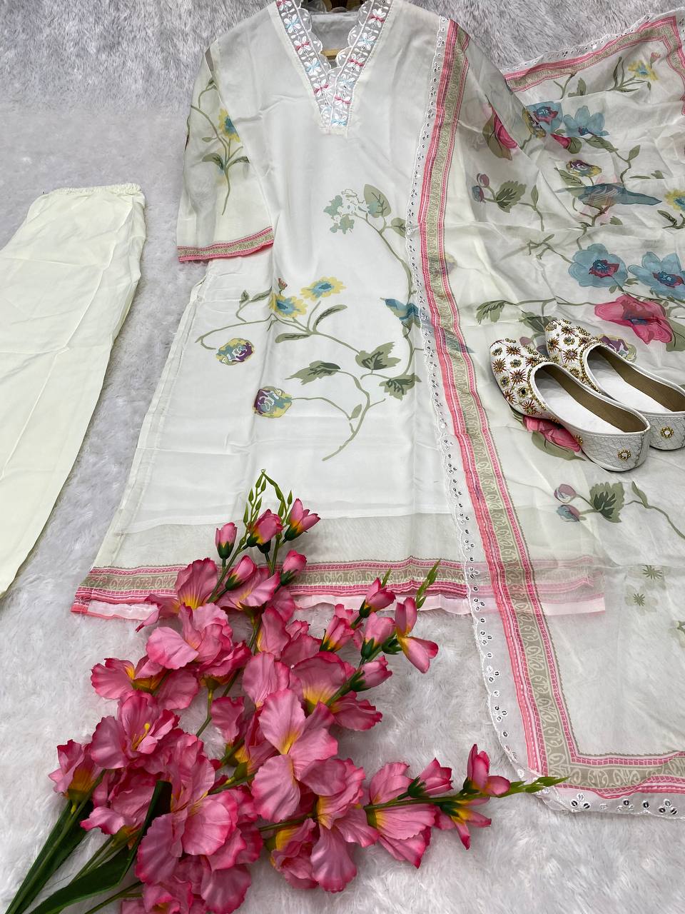 Off White  Color Suit Set  seems to be a party wear outfit made from TB Silk fabric with digital Prints TB Silk Duptta wih Embroidery sequence Lace.(3-Pair)
