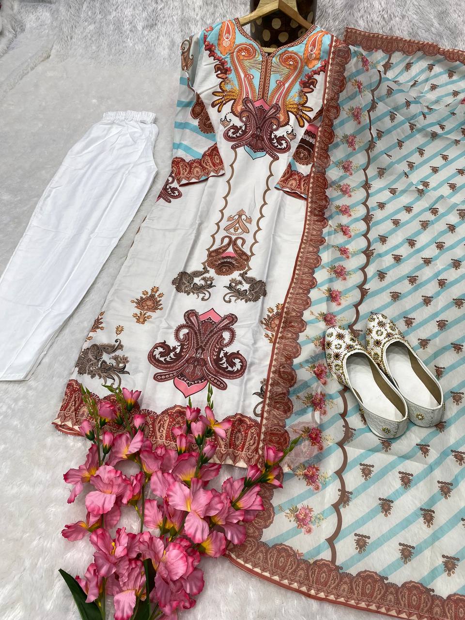 Peach Kurti 3 pair Set you've described seems to be a party wear outfit made from Maslin fabric with digital prints Georgette Duptta.