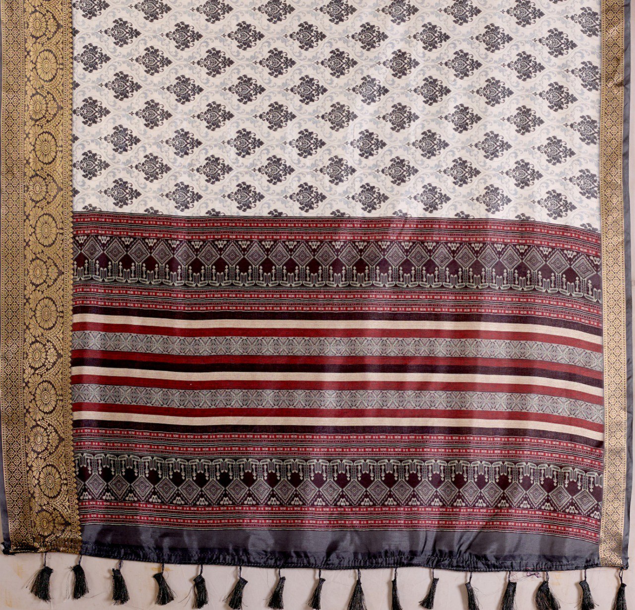 Premium Soft Lichi Silk Saree in Elegant White Base featuring intricate black ethnic motifs, beautifully complemented with a luxurious golden zari woven border and a rich maroon pallu