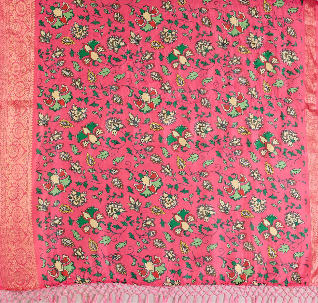 oft Lichi Silk Saree enriched with vibrant floral digital prints and a beautifully woven zari border.