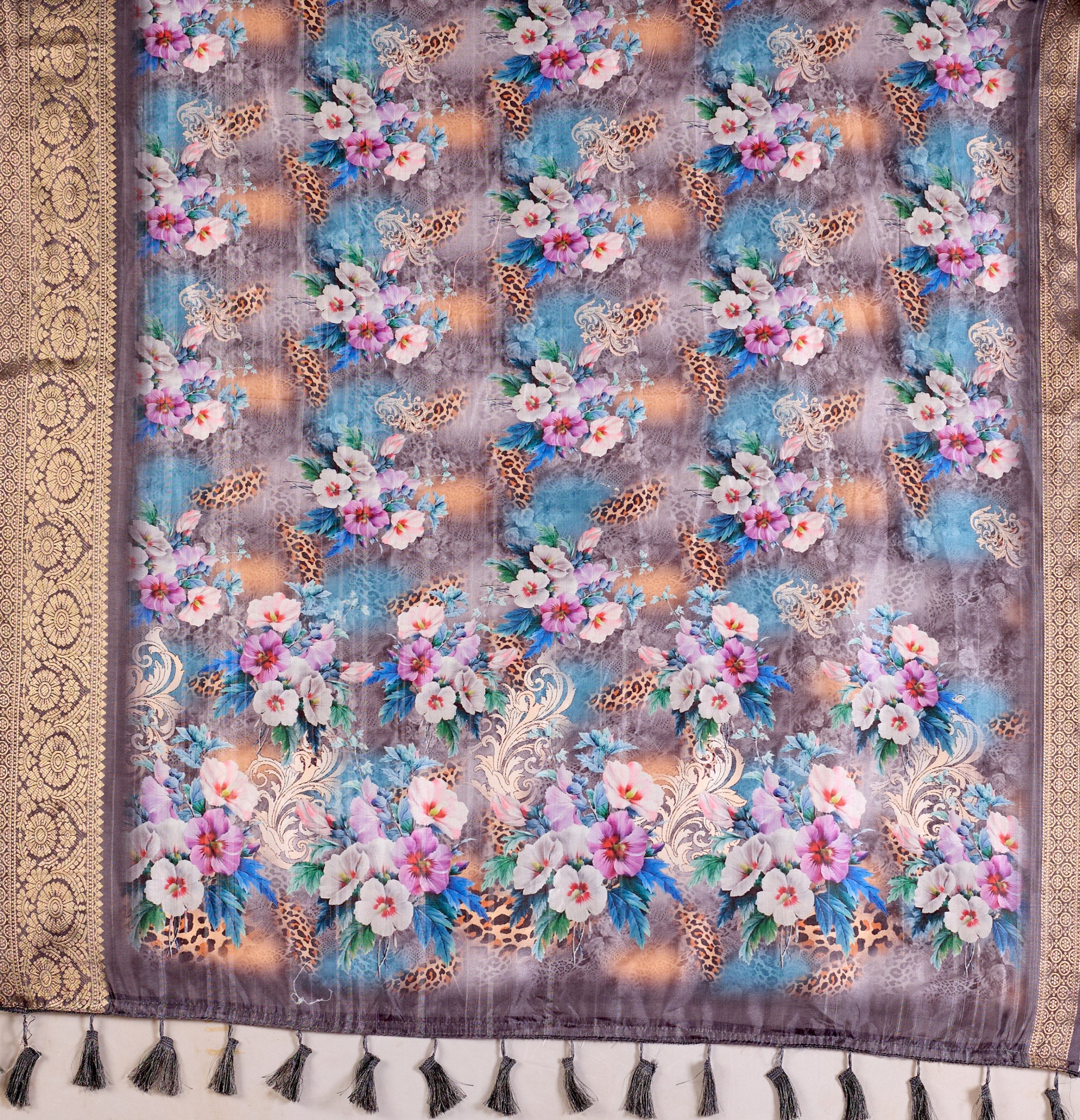Gorgeous Soft Lichi Silk Saree featuring enchanting digital floral prints on a rich smoky grey base with an intricate golden zari border.