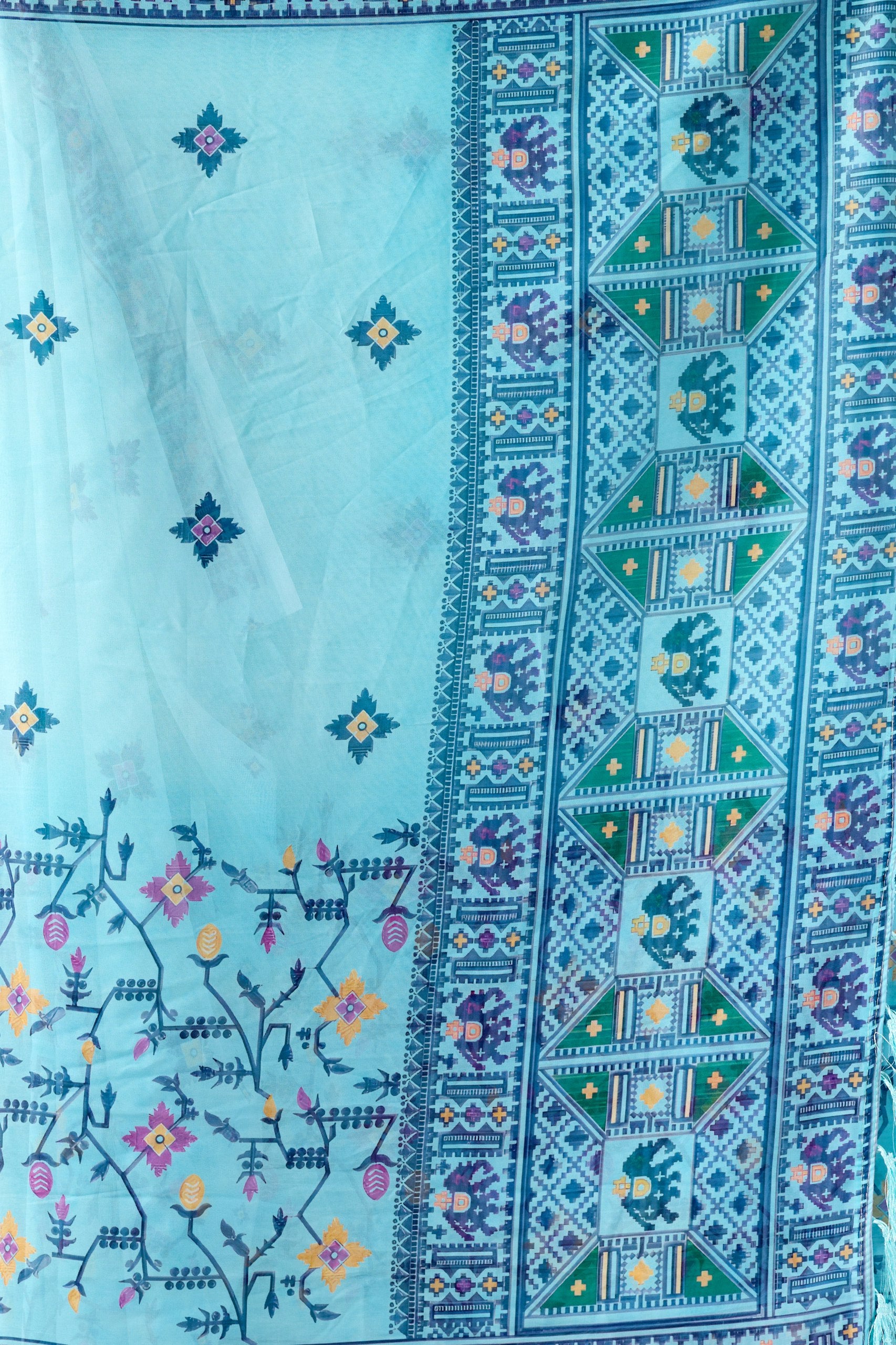 Soft Georgette Saree in Refreshing Sea Green Tone Highlighted with Intricate Digital Tribal & Floral Print, Featuring Artistic Elephant & Geometric Motifs with Elegant Tassel Detailing on Pallu