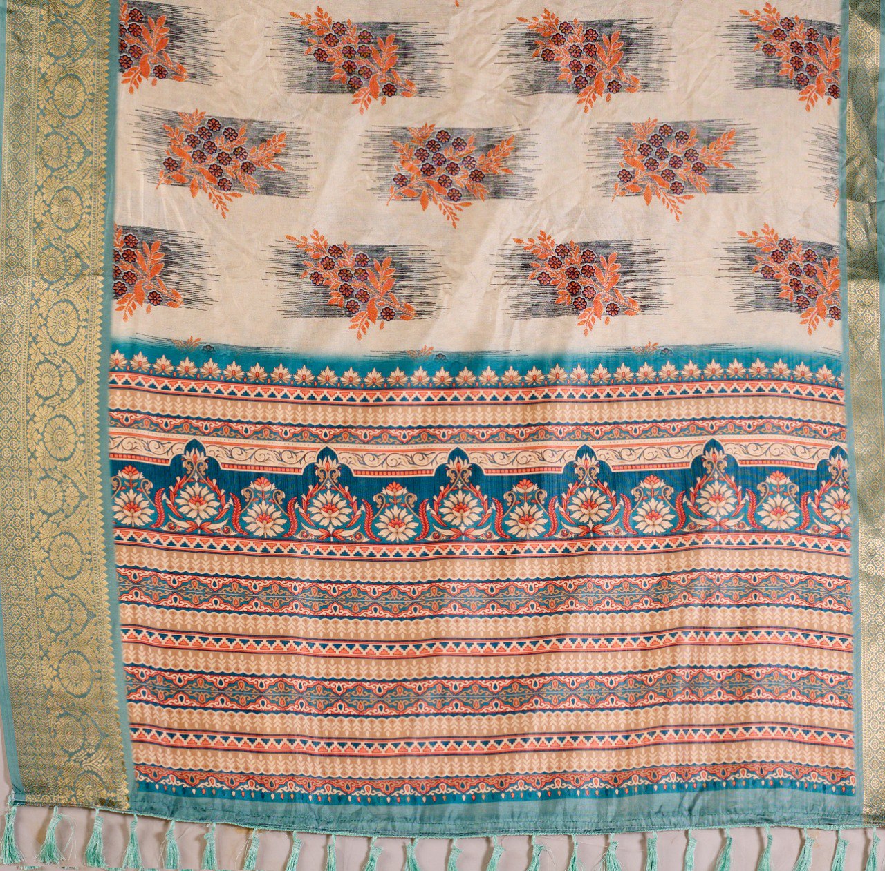 Elegant Soft Lichi Silk Saree in a refined ivory and teal tone, featuring traditional motifs and intricate digital prints enhanced with a golden zari border.