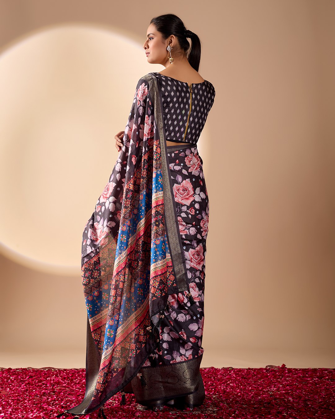 Premium Soft Lichi Silk Saree in Rich Black Tone, adorned with Artistic Floral Prints and a Vibrant Traditional Multicolor Pallu.