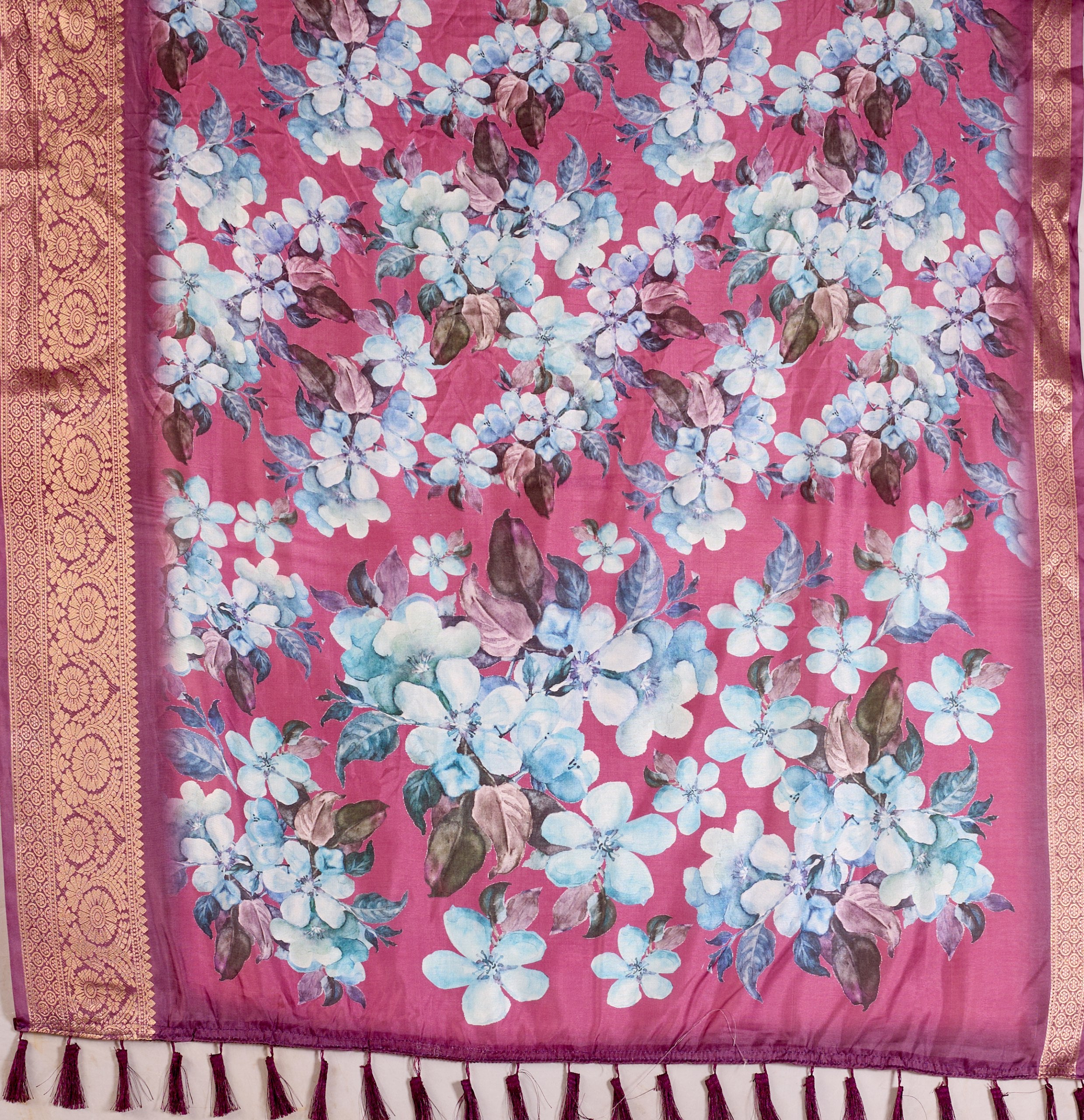 oft Lichi Silk Saree beautifully enhanced with large blooming floral prints and a rich zari woven border.