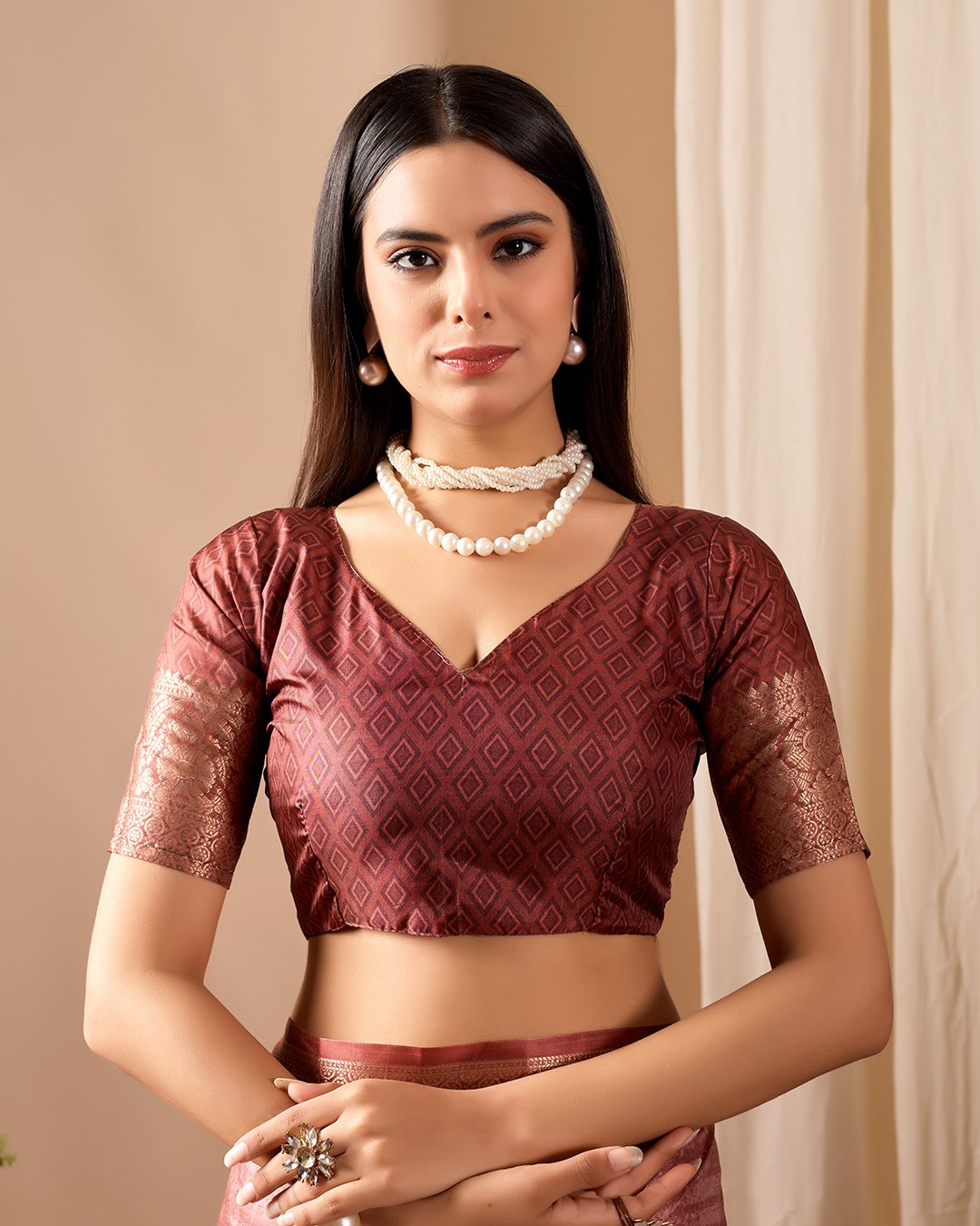 Soft Lichi Silk Saree adorned with graceful Patola-inspired motifs and a rich woven border