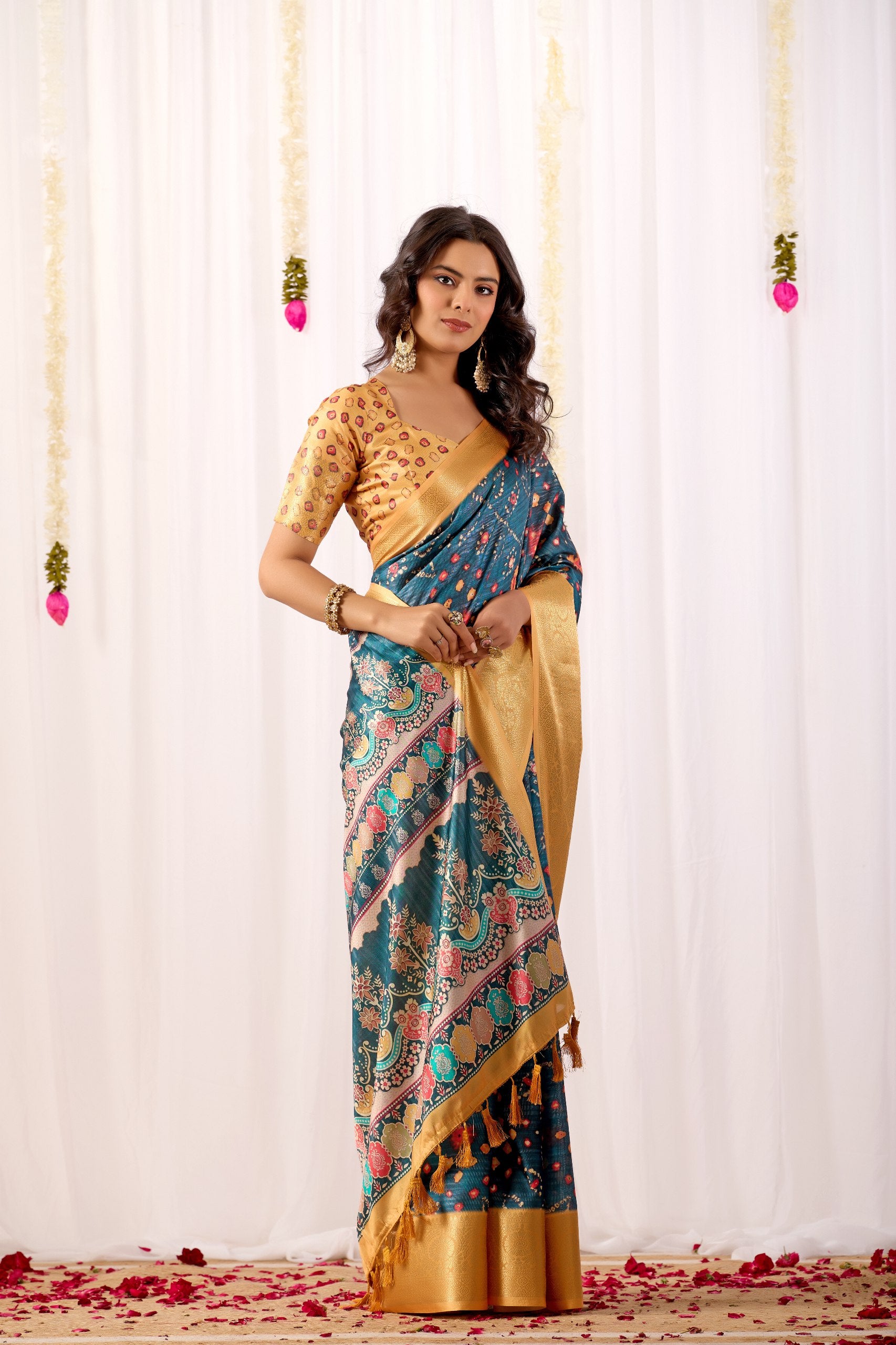Soft Lichi Silk Saree featuring an Elegant Tribal Art Print complemented by a Luxurious Rich Zari Border. The blend of traditional artistry and silky sheen adds a royal touch to your festive look.