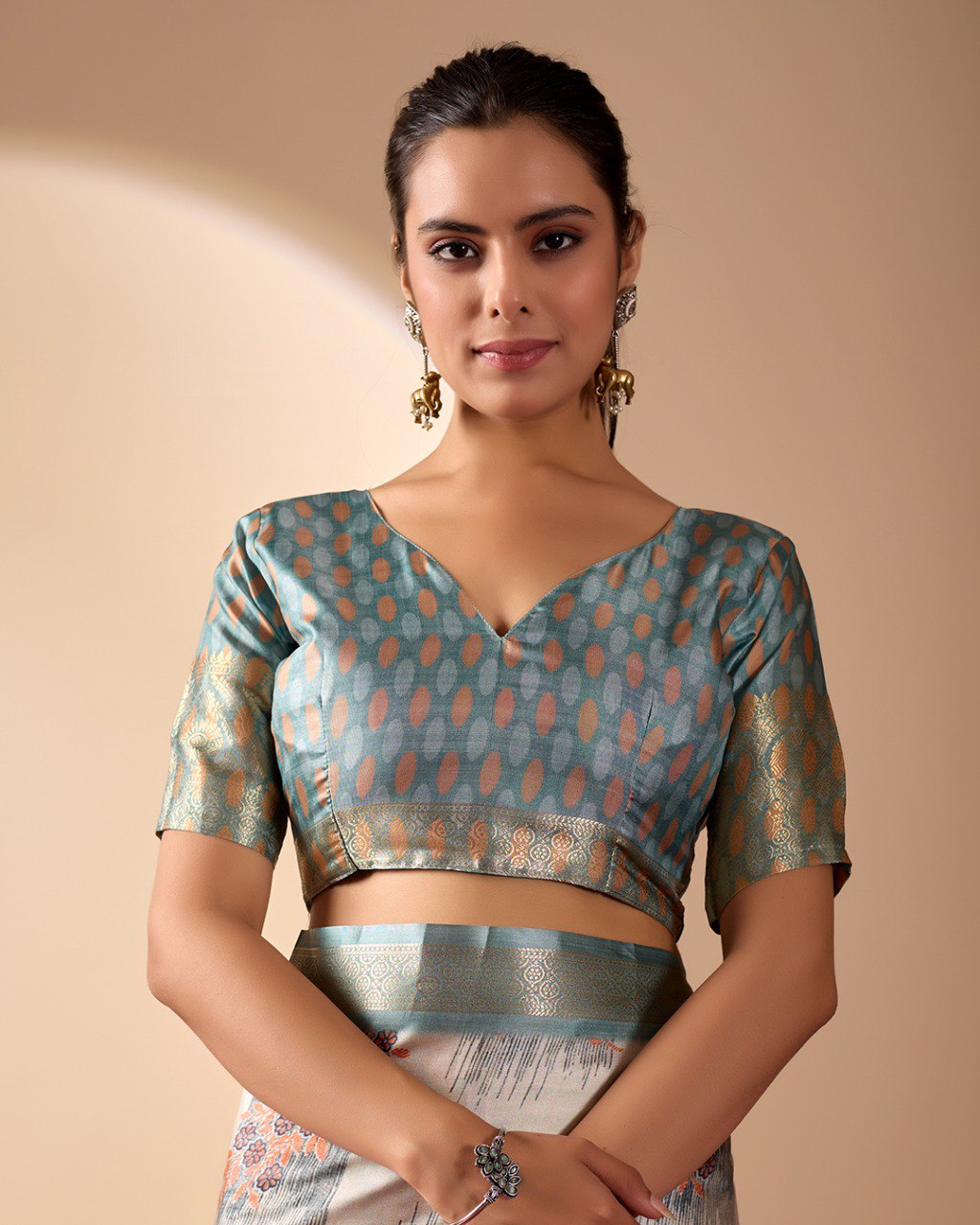 Elegant Soft Lichi Silk Saree in a refined ivory and teal tone, featuring traditional motifs and intricate digital prints enhanced with a golden zari border.