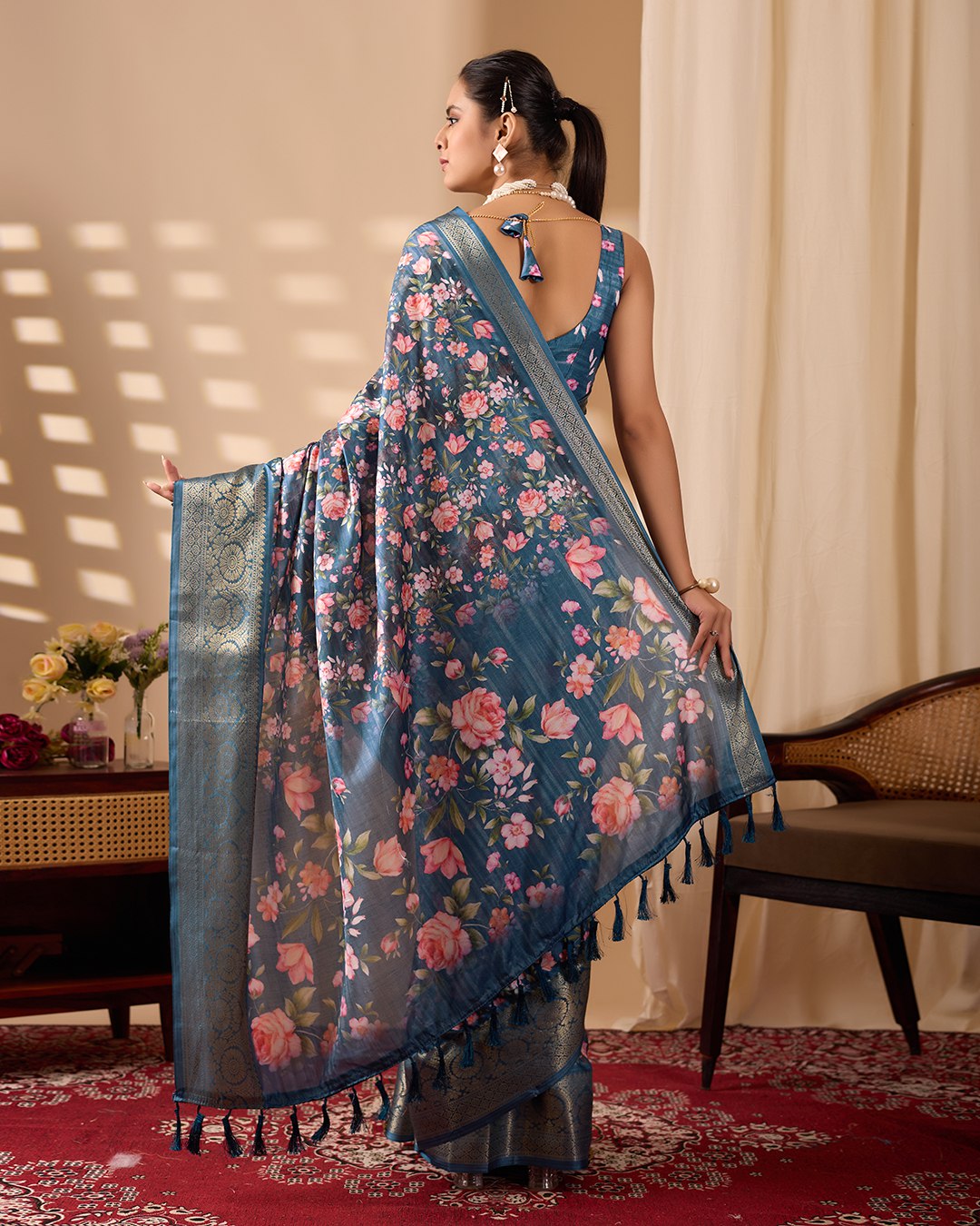 Gorgeous Soft Lichi Silk Saree in Deep Teal Blue, adorned with Romantic Rose Floral Digital Prints and finished with an Intricately Woven Golden Zari Border — perfect for festive gatherings, elegant evenings, or special celebrations.