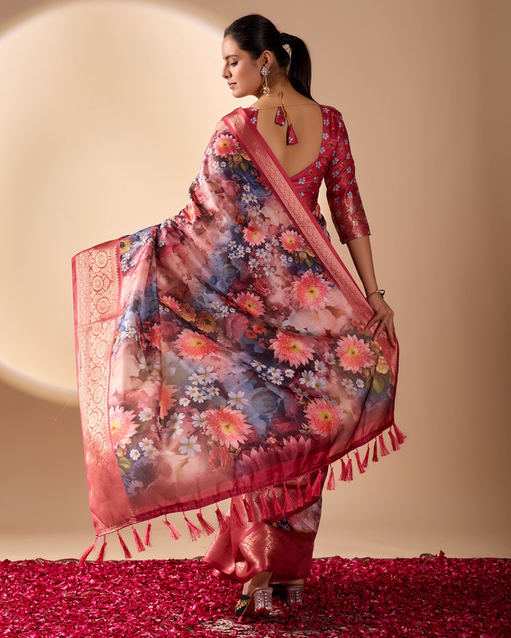 Luxurious Soft Lichi Silk Saree in Deep Wine Rose Shade featuring enchanting floral digital prints and complemented by a rich woven zari border & pallu — an epitome of elegance, beauty, and sophistication.