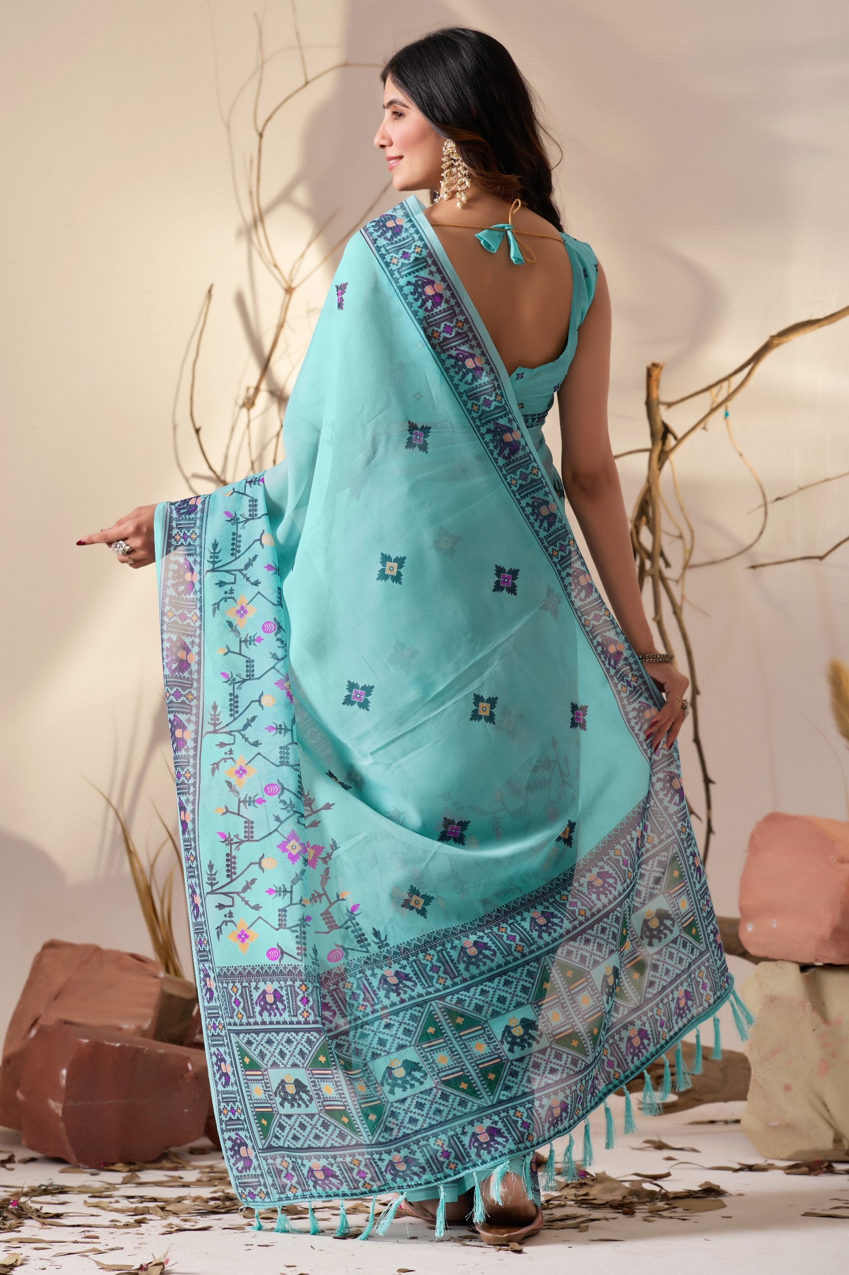 Soft Georgette Saree in Refreshing Sea Green Tone Highlighted with Intricate Digital Tribal & Floral Print, Featuring Artistic Elephant & Geometric Motifs with Elegant Tassel Detailing on Pallu