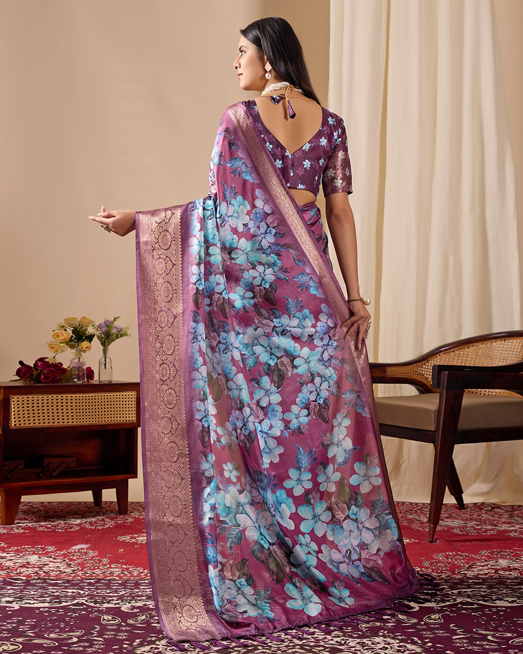 oft Lichi Silk Saree beautifully enhanced with large blooming floral prints and a rich zari woven border.