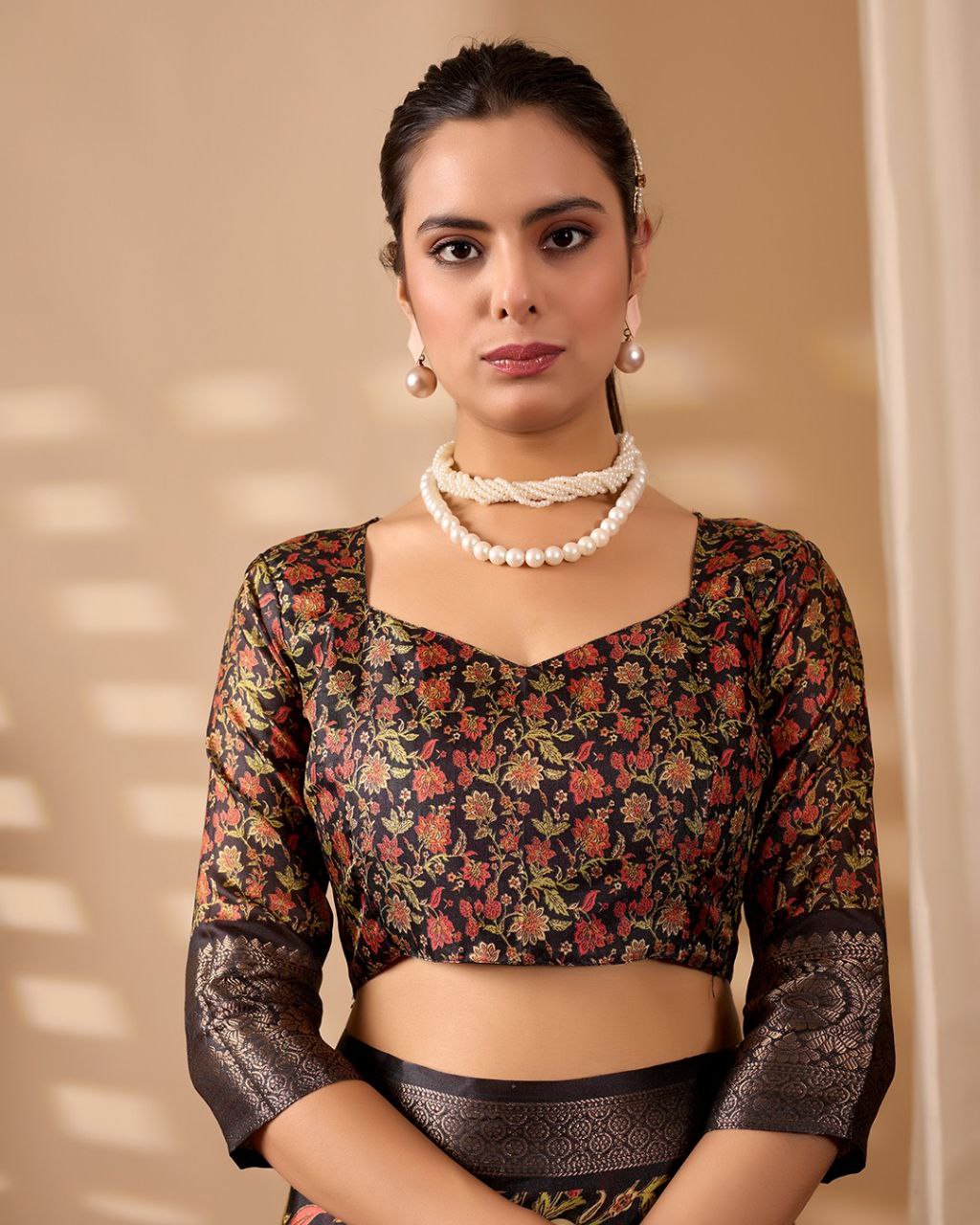 Exquisite Soft Lichi Silk Saree featuring stunning digital floral motifs on a rich black base, beautifully complemented by a luxurious golden zari border.