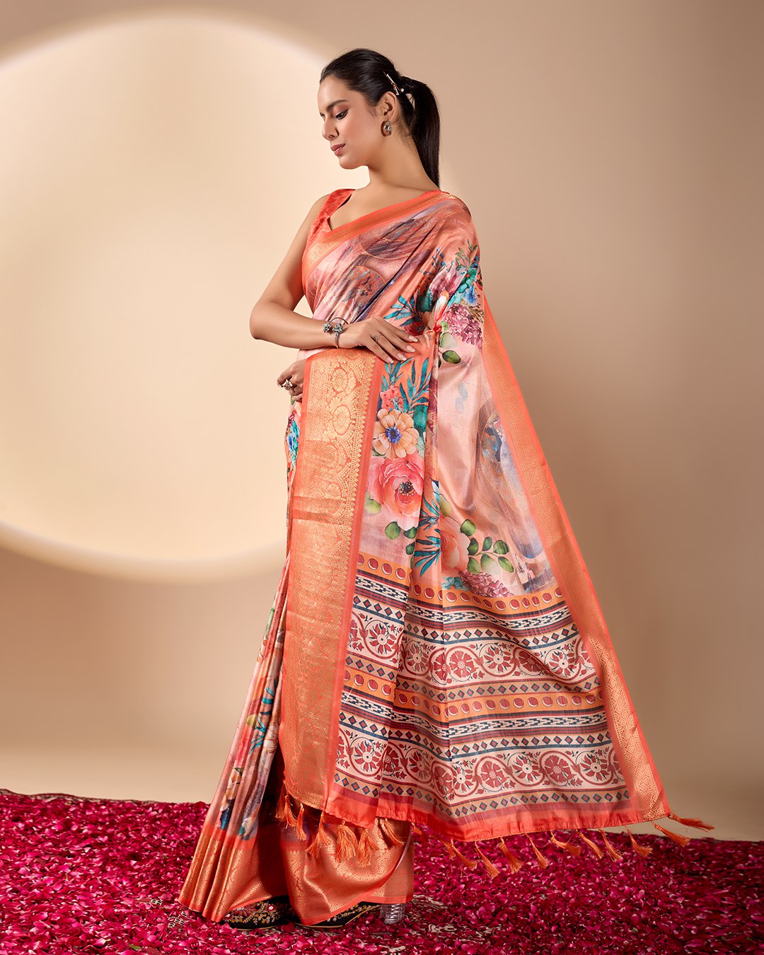 Soft Lichi Silk Saree adorned with elegant floral patterns and intricate Patola-inspired pallu, complemented by a luxurious zari woven border