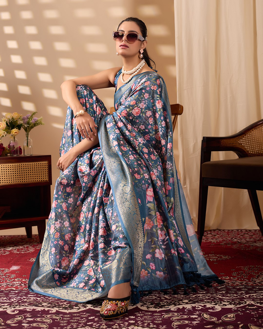 Gorgeous Soft Lichi Silk Saree in Deep Teal Blue, adorned with Romantic Rose Floral Digital Prints and finished with an Intricately Woven Golden Zari Border — perfect for festive gatherings, elegant evenings, or special celebrations.