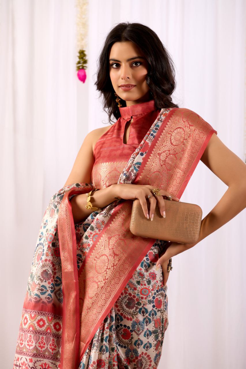 Premium Soft Lichi Silk Saree with elegant Patola-inspired geometric prints beautifully crafted with a luxurious zari woven border.