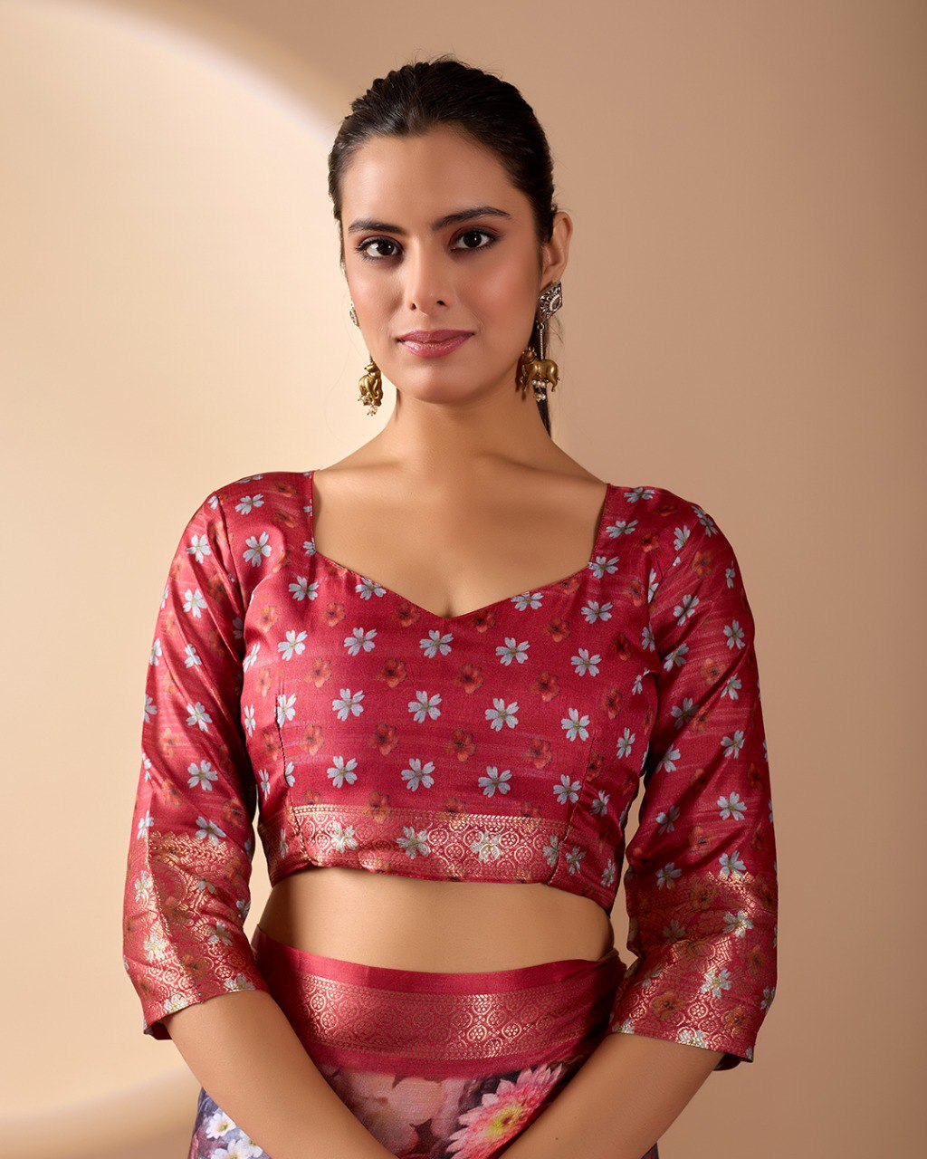Luxurious Soft Lichi Silk Saree in Deep Wine Rose Shade featuring enchanting floral digital prints and complemented by a rich woven zari border & pallu — an epitome of elegance, beauty, and sophistication.