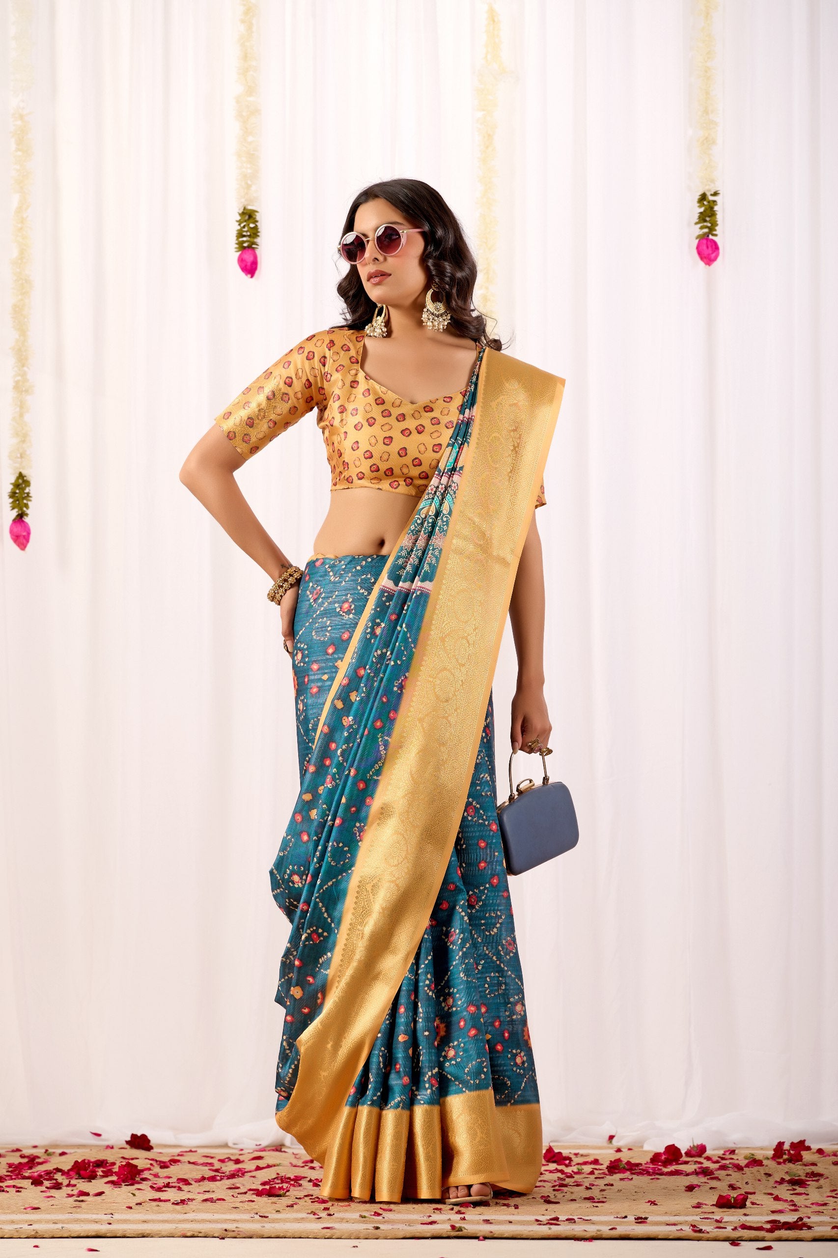 Soft Lichi Silk Saree featuring an Elegant Tribal Art Print complemented by a Luxurious Rich Zari Border. The blend of traditional artistry and silky sheen adds a royal touch to your festive look.