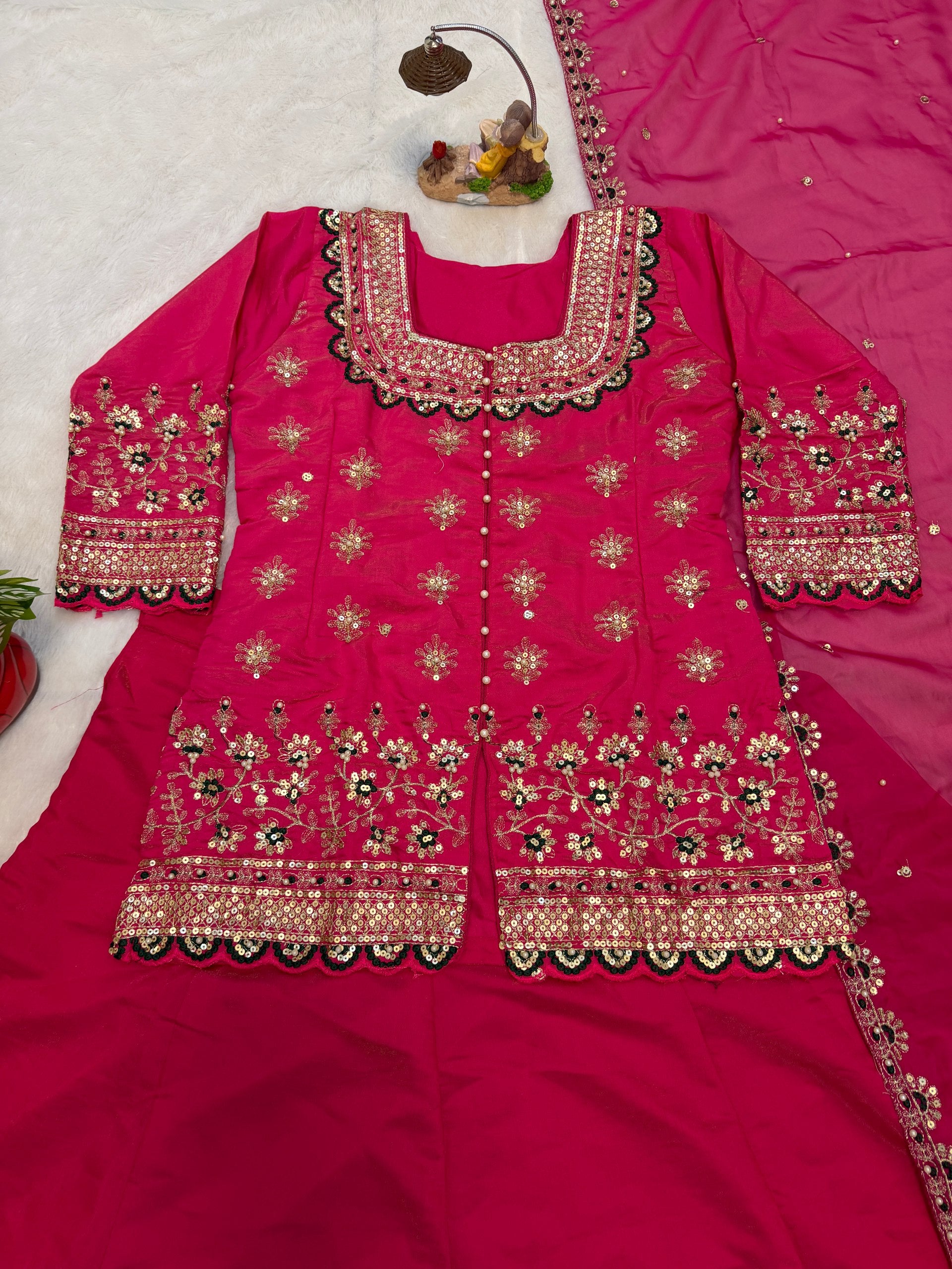 Turn every celebration into a style statement with this luxurious Simmer Silk Lehenga Set, crafted with fine embroidery and elegant moti work