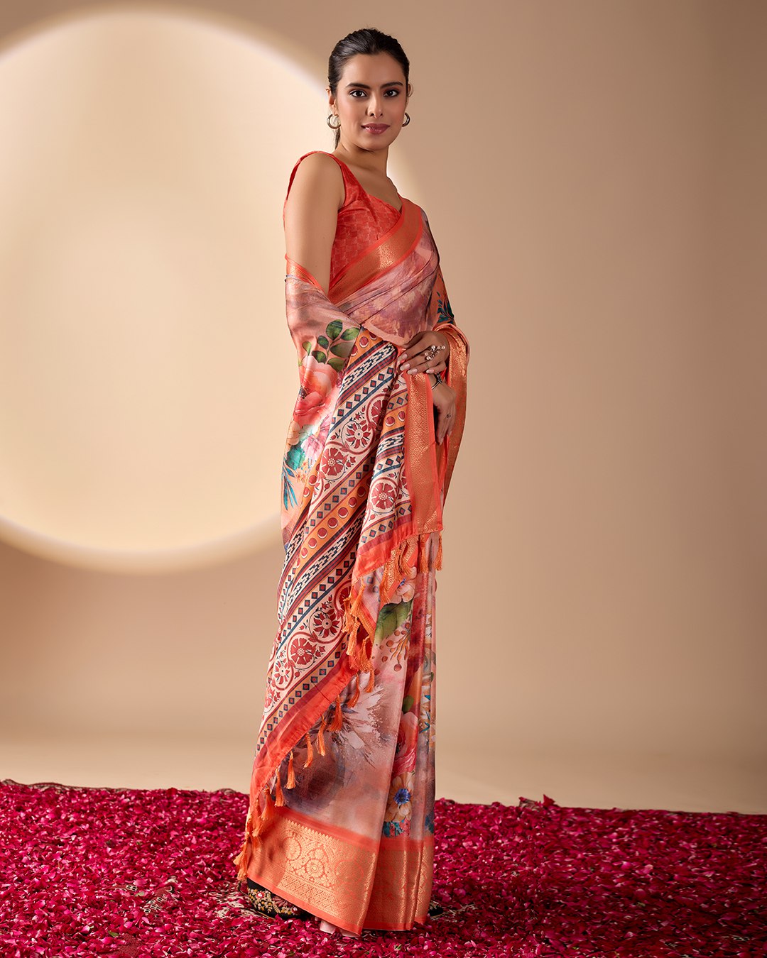 Soft Lichi Silk Saree adorned with elegant floral patterns and intricate Patola-inspired pallu, complemented by a luxurious zari woven border
