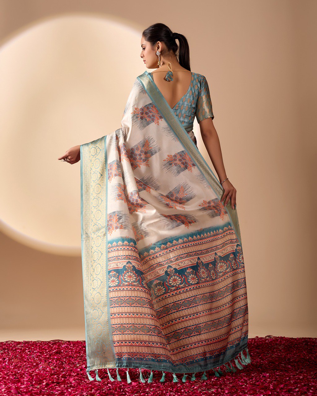 Elegant Soft Lichi Silk Saree in a refined ivory and teal tone, featuring traditional motifs and intricate digital prints enhanced with a golden zari border.