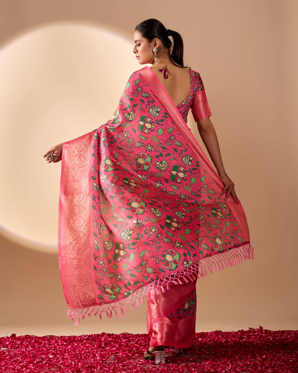 oft Lichi Silk Saree enriched with vibrant floral digital prints and a beautifully woven zari border.