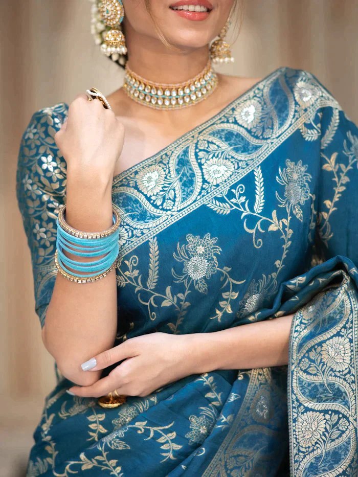 The richly crafted border and opulent pallu showcase traditional Banarasi Silk sarees