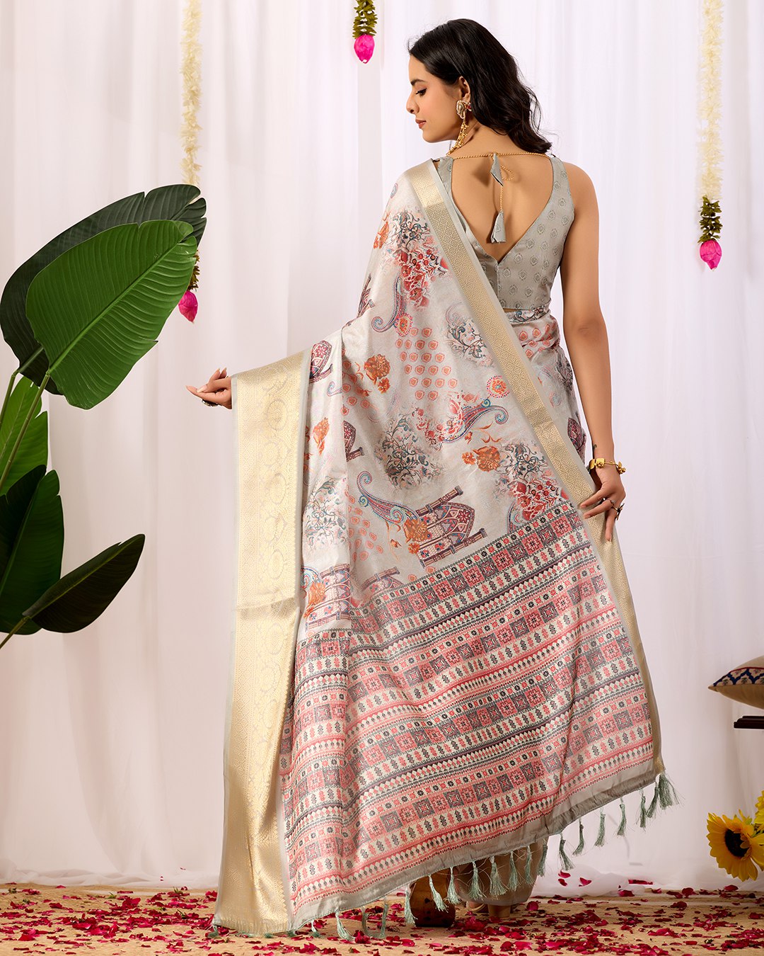 Elegant Soft Lichi Silk Saree featuring royal ethnic motifs with a lavish golden zari woven border, bringing together rich heritage and modern sophistication.