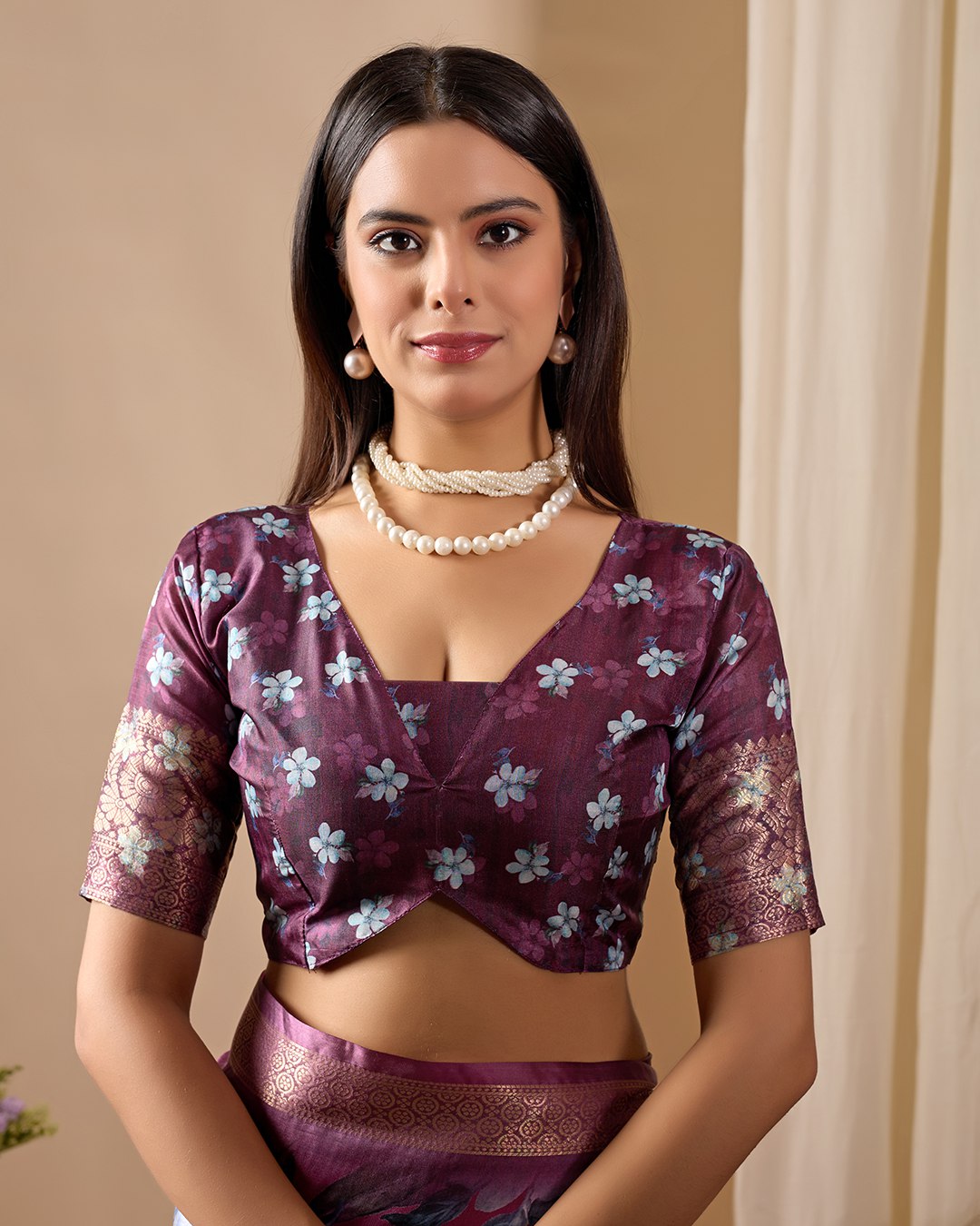 oft Lichi Silk Saree beautifully enhanced with large blooming floral prints and a rich zari woven border.