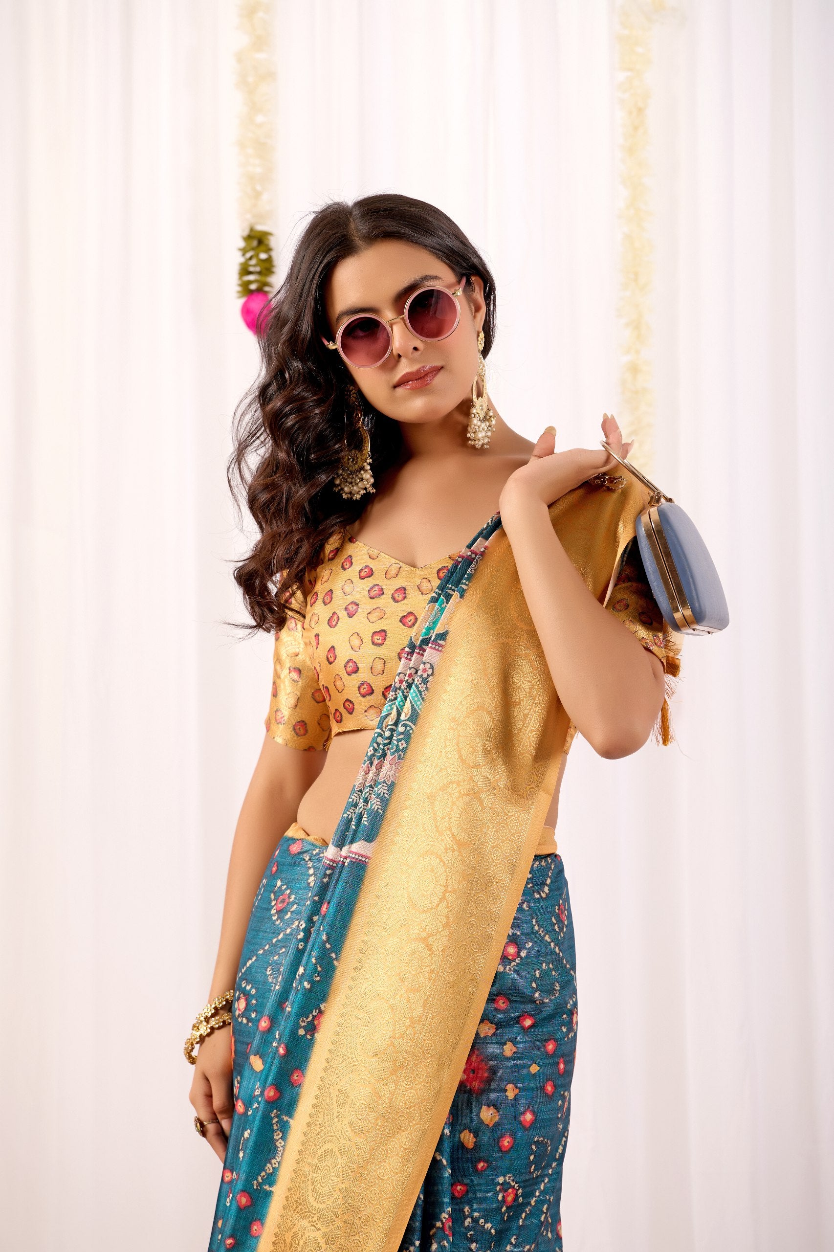 Soft Lichi Silk Saree featuring an Elegant Tribal Art Print complemented by a Luxurious Rich Zari Border. The blend of traditional artistry and silky sheen adds a royal touch to your festive look.