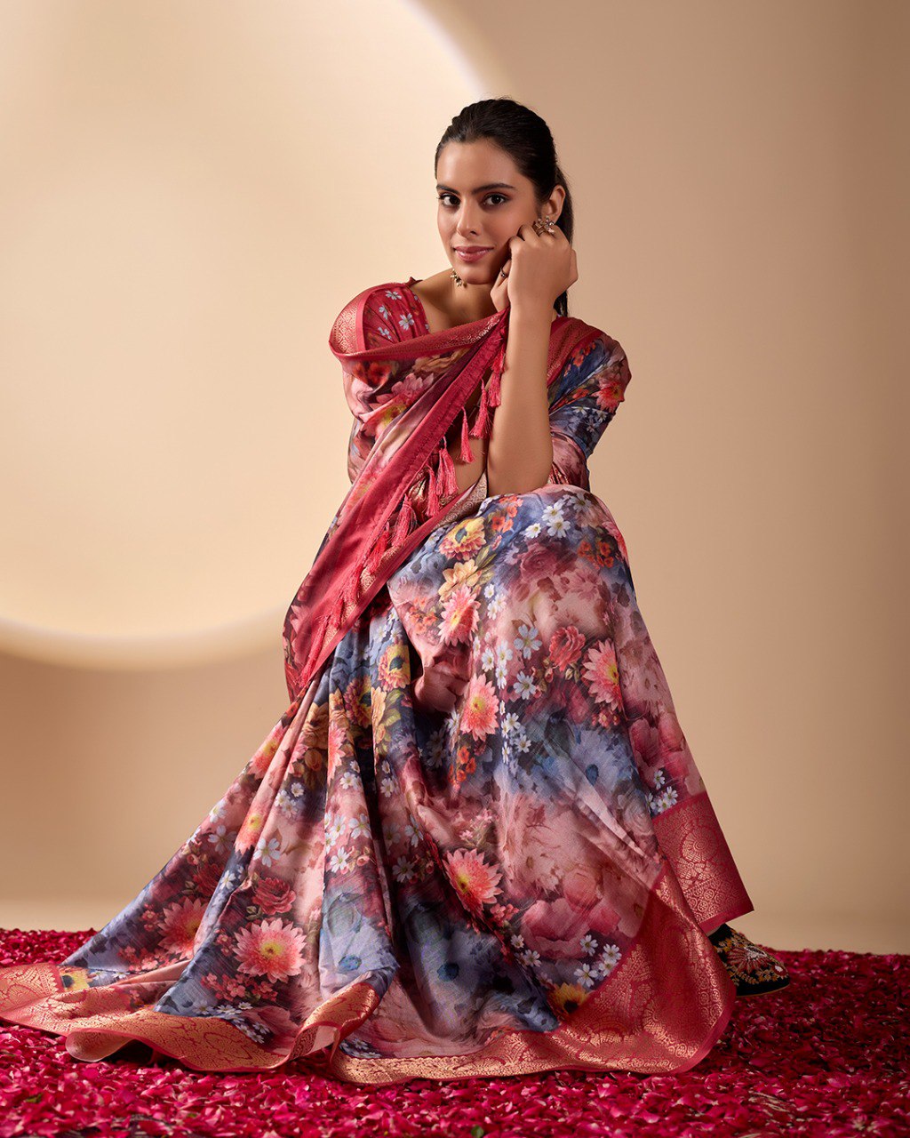 Luxurious Soft Lichi Silk Saree in Deep Wine Rose Shade featuring enchanting floral digital prints and complemented by a rich woven zari border & pallu — an epitome of elegance, beauty, and sophistication.