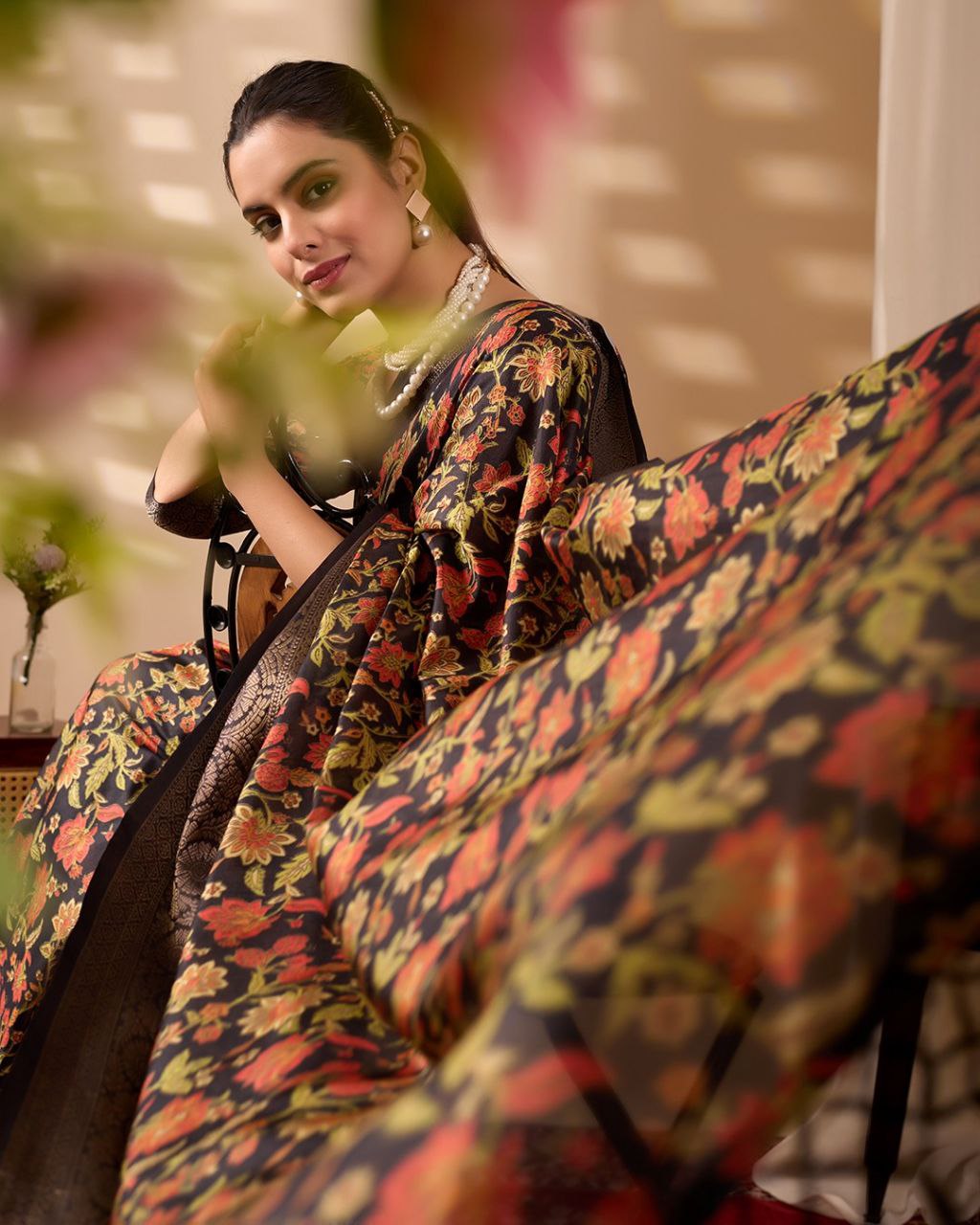 Exquisite Soft Lichi Silk Saree featuring stunning digital floral motifs on a rich black base, beautifully complemented by a luxurious golden zari border.
