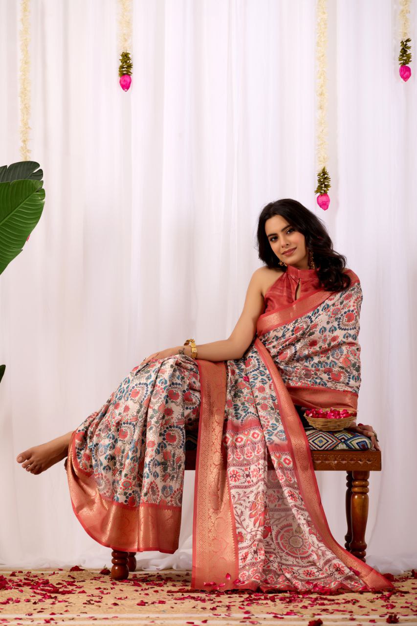 Premium Soft Lichi Silk Saree with elegant Patola-inspired geometric prints beautifully crafted with a luxurious zari woven border.