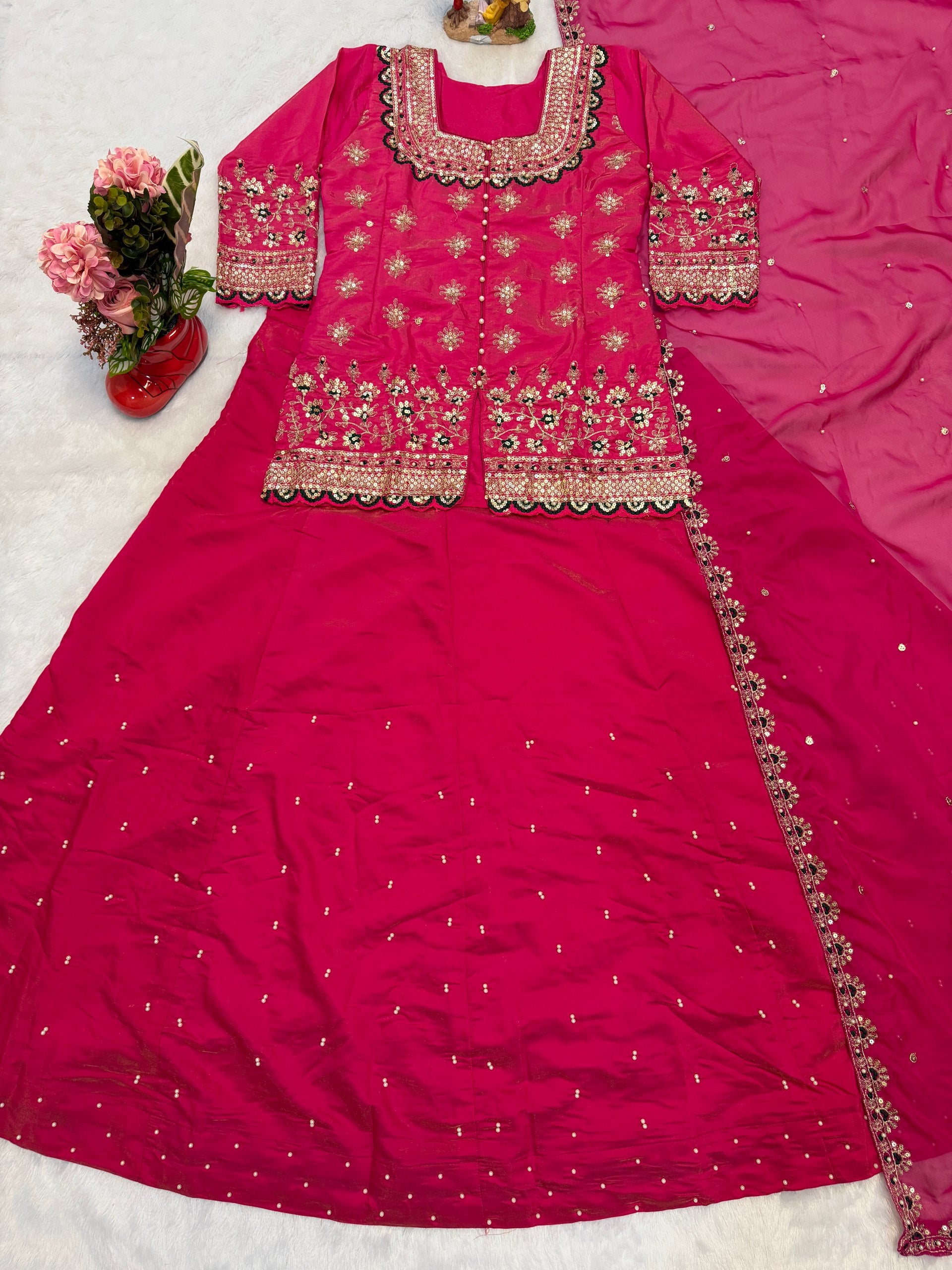 Turn every celebration into a style statement with this luxurious Simmer Silk Lehenga Set, crafted with fine embroidery and elegant moti work