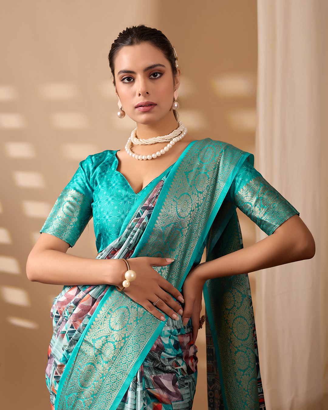 Premium Soft Lichi Silk Saree in Elegant Sea Green Shade, adorned with Artistic Abstract & Floral Digital Prints and enriched with a Luxurious Golden Zari Woven Border — a perfect blend of tradition and trend for festive & party occasions.