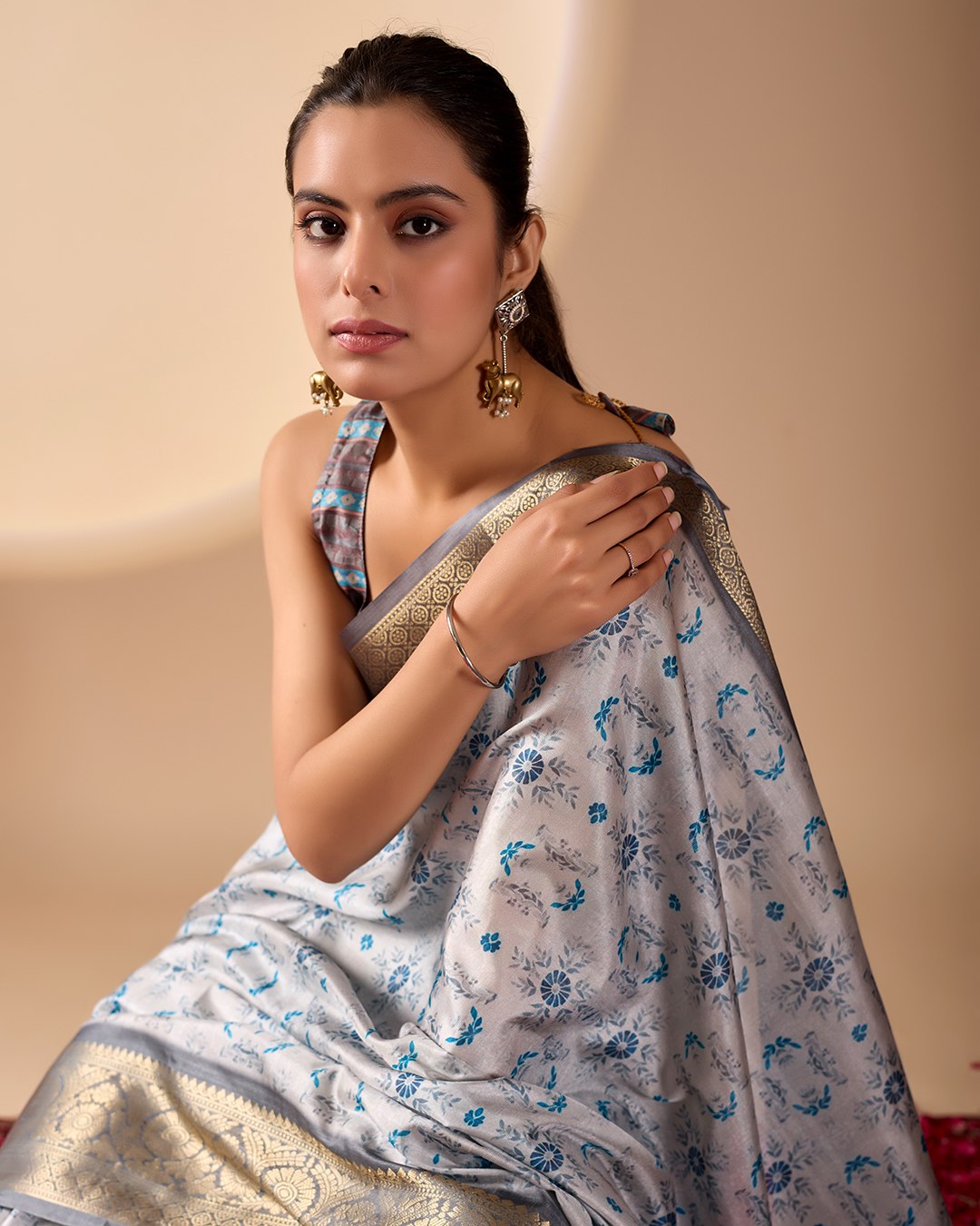 Premium Soft Lichi Silk Saree in Elegant Sea Green Shade, adorned with Artistic Abstract & Floral Digital Prints and enriched with a Luxurious Golden Zari Woven Border