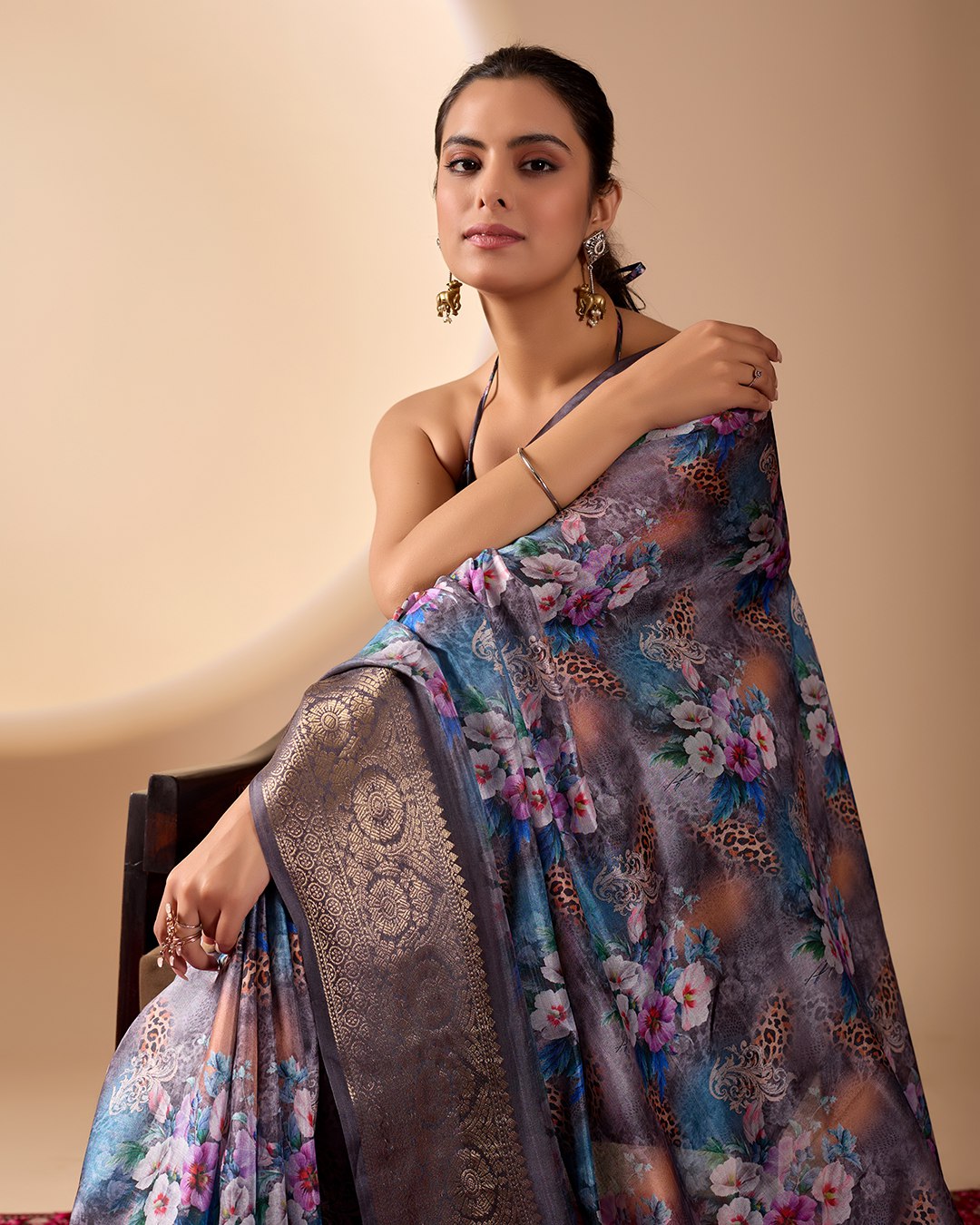 Gorgeous Soft Lichi Silk Saree featuring enchanting digital floral prints on a rich smoky grey base with an intricate golden zari border.