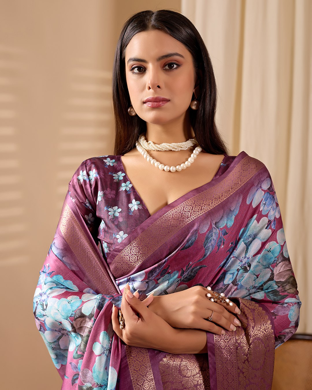 oft Lichi Silk Saree beautifully enhanced with large blooming floral prints and a rich zari woven border.