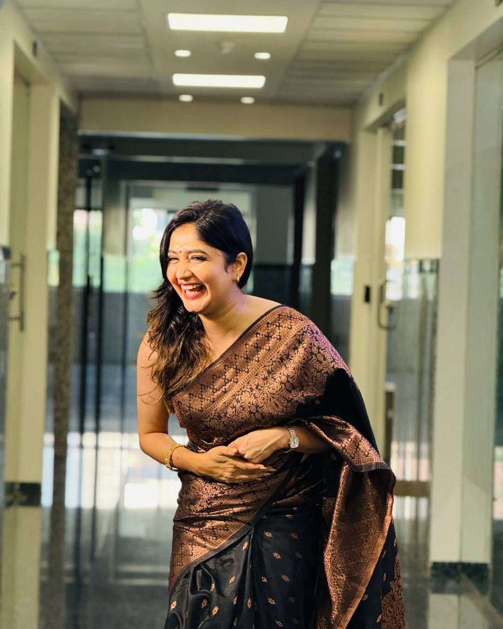 Black South Indian Saree in Soft Lichi Silk With Copper Zari Weaving and Blouse