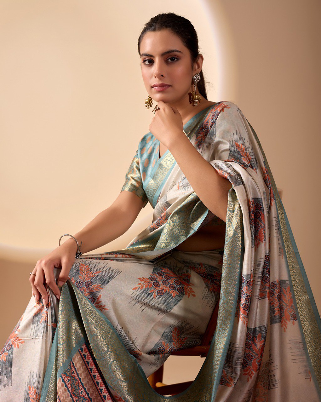 Elegant Soft Lichi Silk Saree in a refined ivory and teal tone, featuring traditional motifs and intricate digital prints enhanced with a golden zari border.