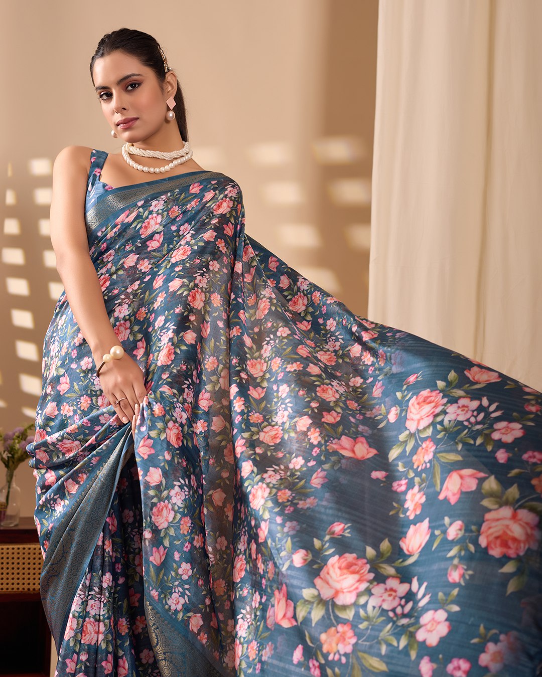 Gorgeous Soft Lichi Silk Saree in Deep Teal Blue, adorned with Romantic Rose Floral Digital Prints and finished with an Intricately Woven Golden Zari Border — perfect for festive gatherings, elegant evenings, or special celebrations.