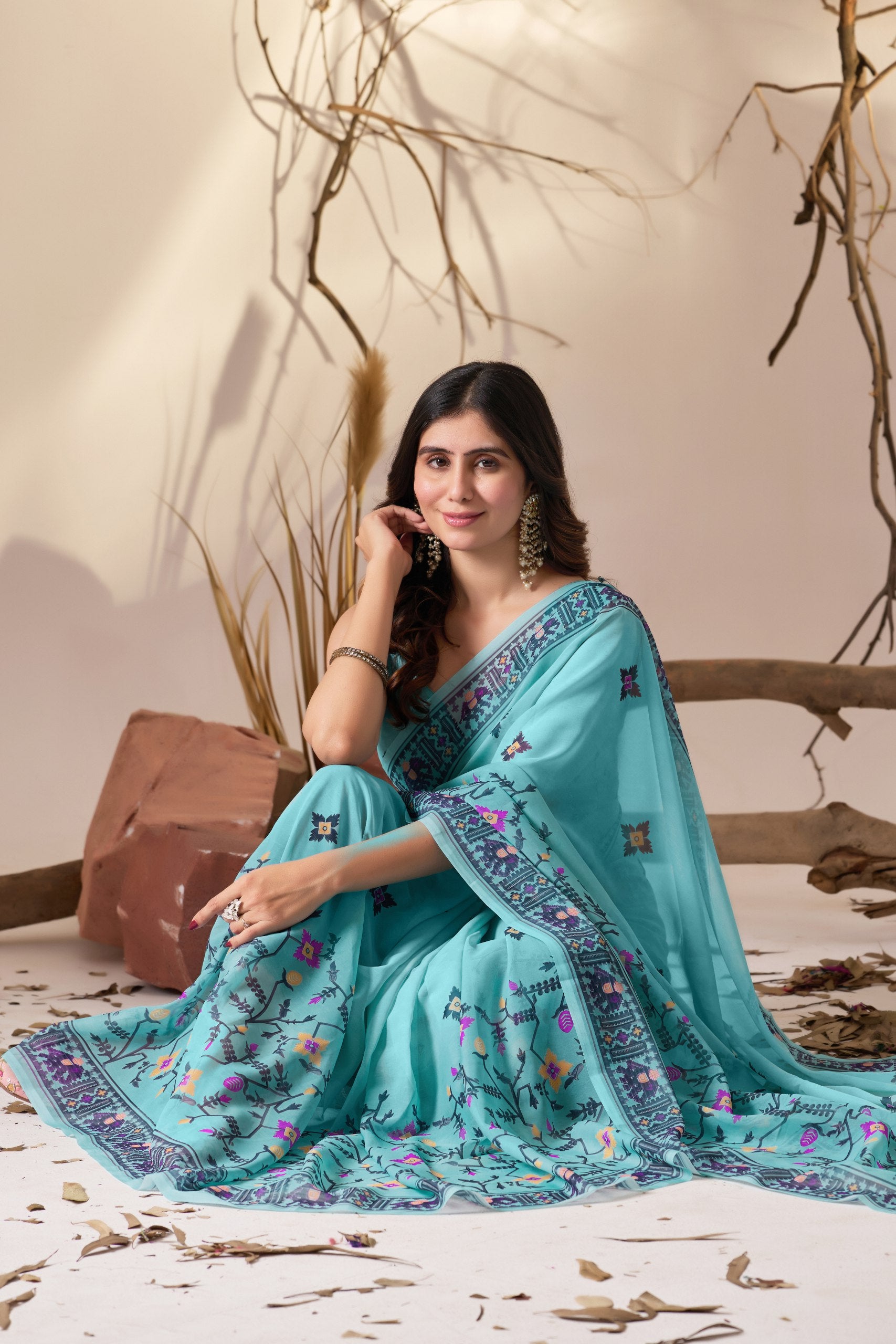 Soft Georgette Saree in Refreshing Sea Green Tone Highlighted with Intricate Digital Tribal & Floral Print, Featuring Artistic Elephant & Geometric Motifs with Elegant Tassel Detailing on Pallu