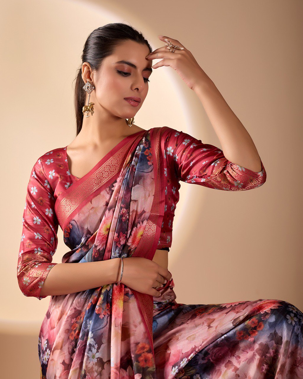 Luxurious Soft Lichi Silk Saree in Deep Wine Rose Shade featuring enchanting floral digital prints and complemented by a rich woven zari border & pallu — an epitome of elegance, beauty, and sophistication.