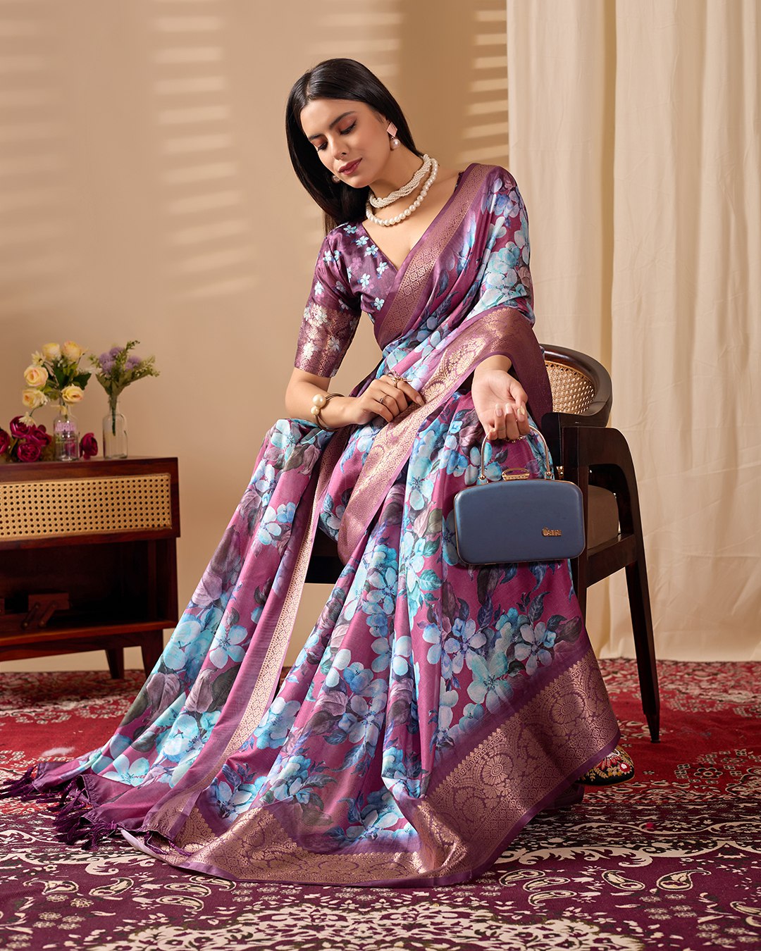 oft Lichi Silk Saree beautifully enhanced with large blooming floral prints and a rich zari woven border.