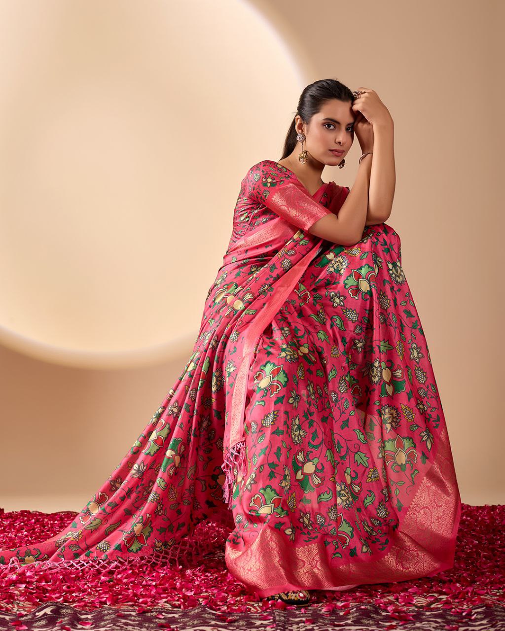oft Lichi Silk Saree enriched with vibrant floral digital prints and a beautifully woven zari border.