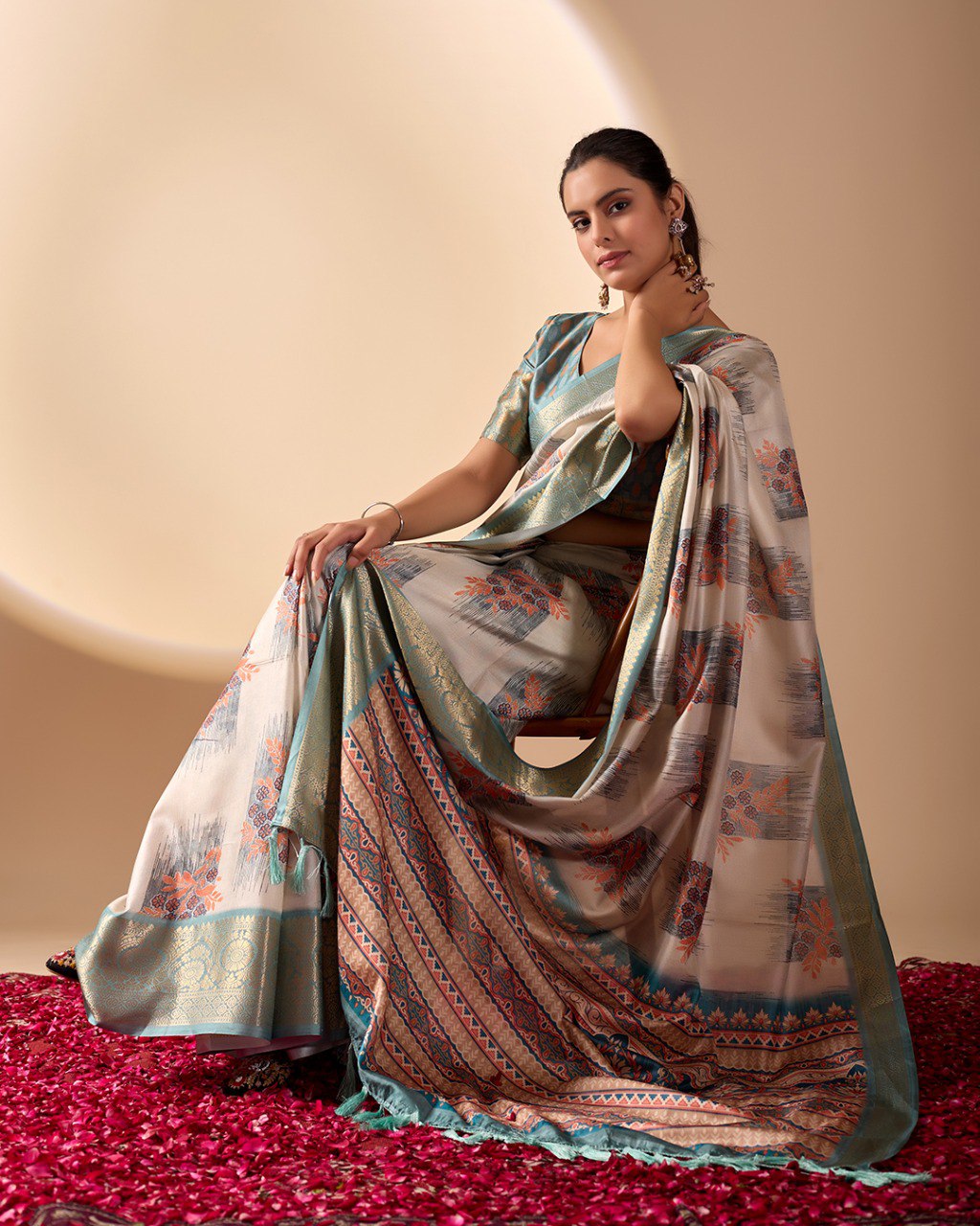 Elegant Soft Lichi Silk Saree in a refined ivory and teal tone, featuring traditional motifs and intricate digital prints enhanced with a golden zari border.