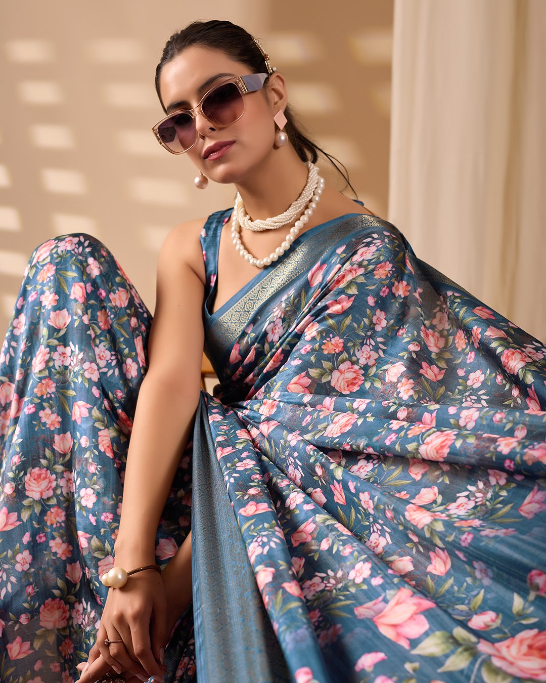 Gorgeous Soft Lichi Silk Saree in Deep Teal Blue, adorned with Romantic Rose Floral Digital Prints and finished with an Intricately Woven Golden Zari Border — perfect for festive gatherings, elegant evenings, or special celebrations.
