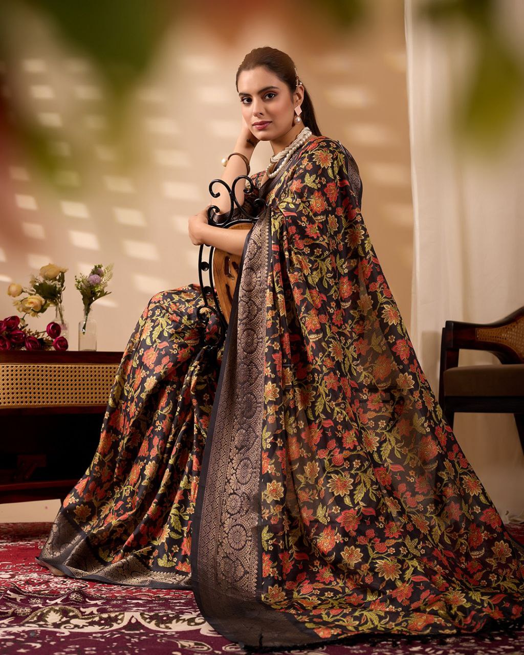 Exquisite Soft Lichi Silk Saree featuring stunning digital floral motifs on a rich black base, beautifully complemented by a luxurious golden zari border.