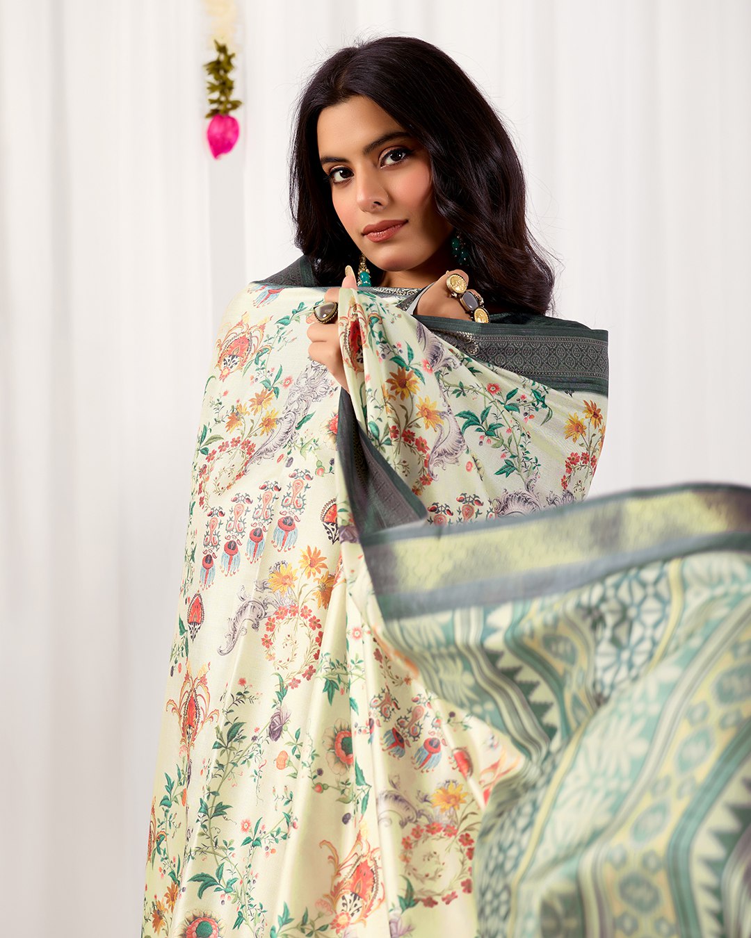Premium Soft Lichi Silk Saree adorned with vibrant digital floral prints, complemented by a rich, intricately woven zari border — a perfect blend of luxury and tradition.
